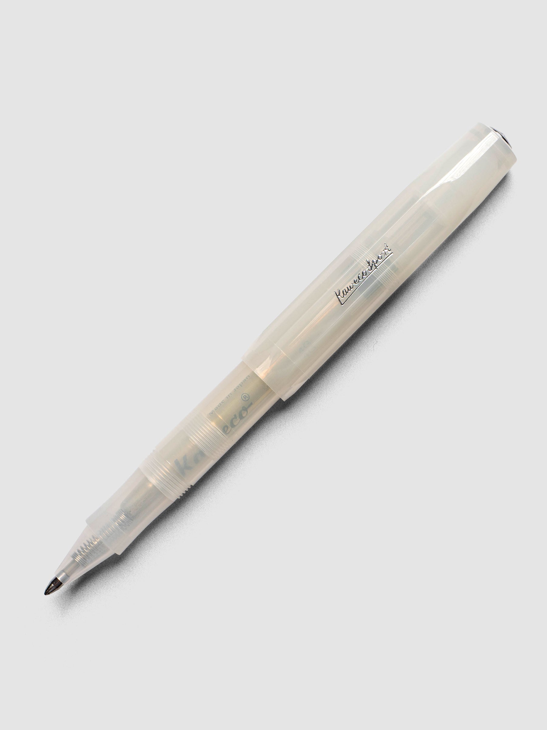 A clear rollerball pen shown with cap posted.
