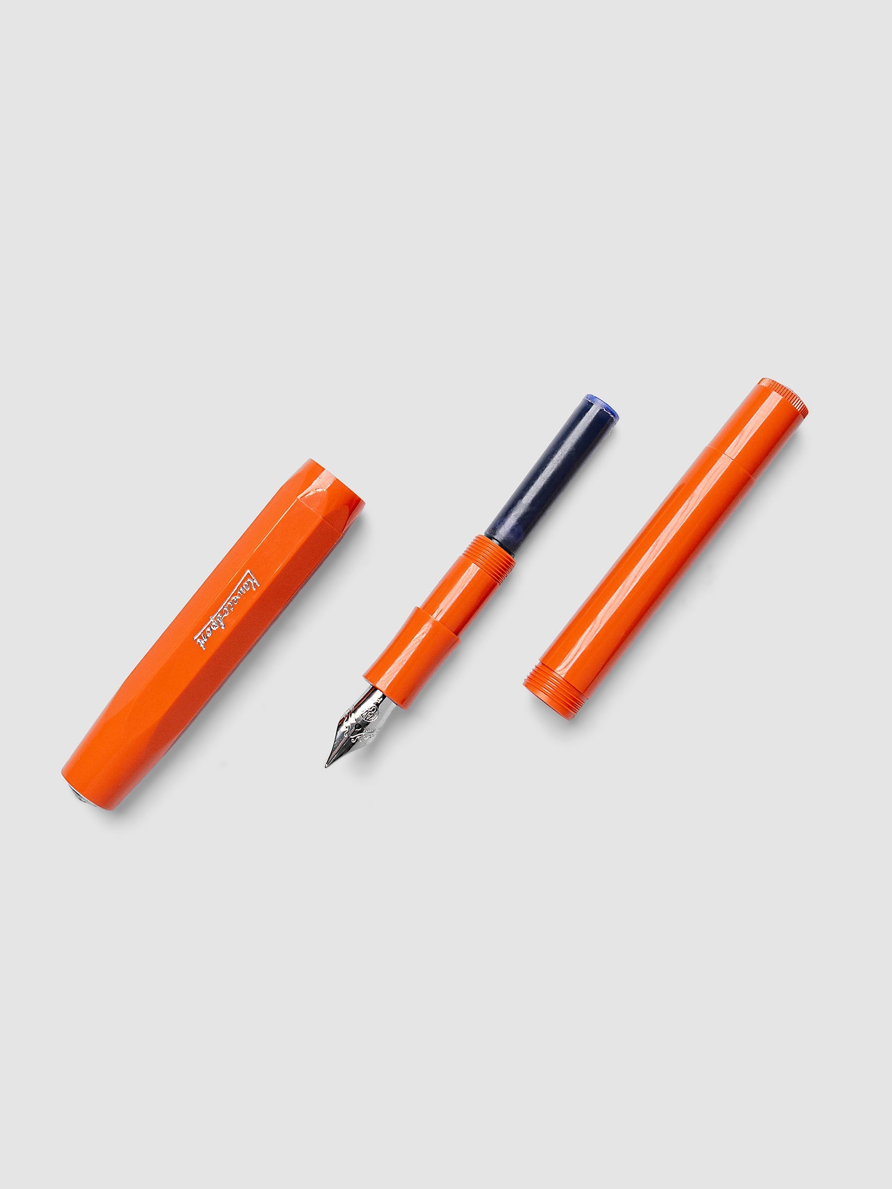 Disassembled Kaweco Classic Sport Fountain Pen in Fox, an orange, with a fine tip nib