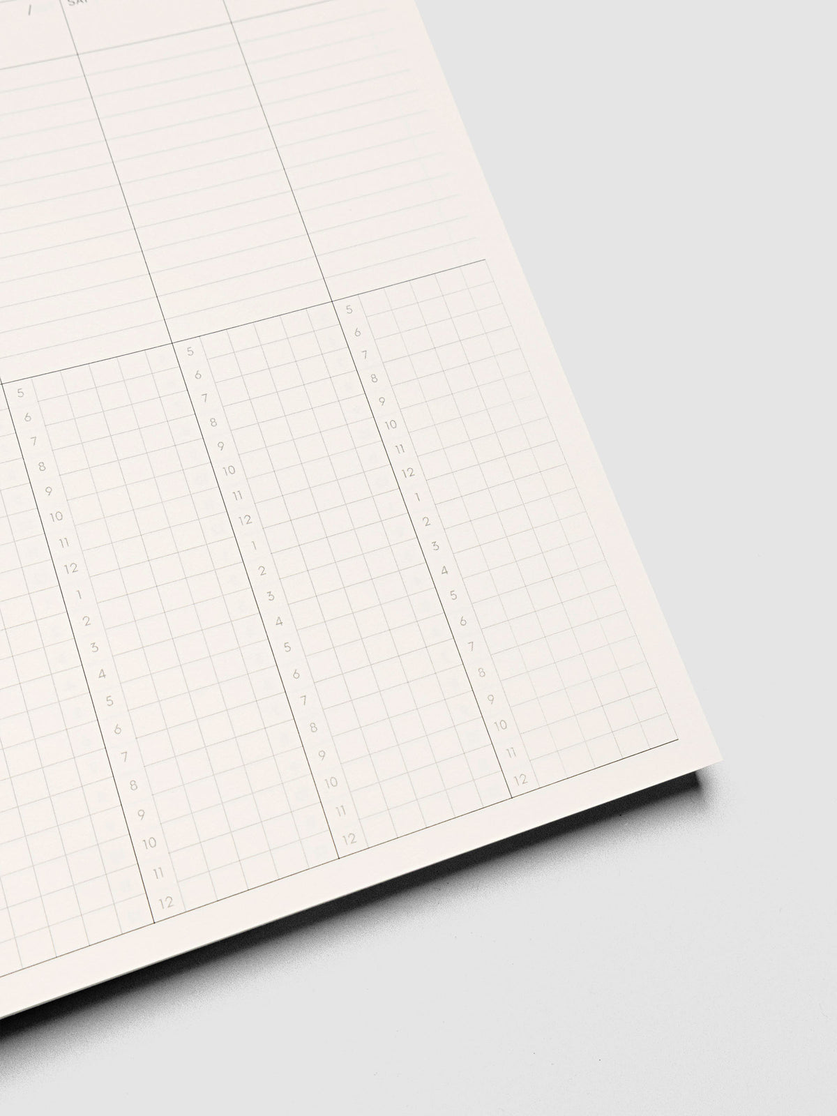 Spiral Notebook in size A5 and color Hyacinth blue shown open and close up displaying vertical weekly time block layout.
