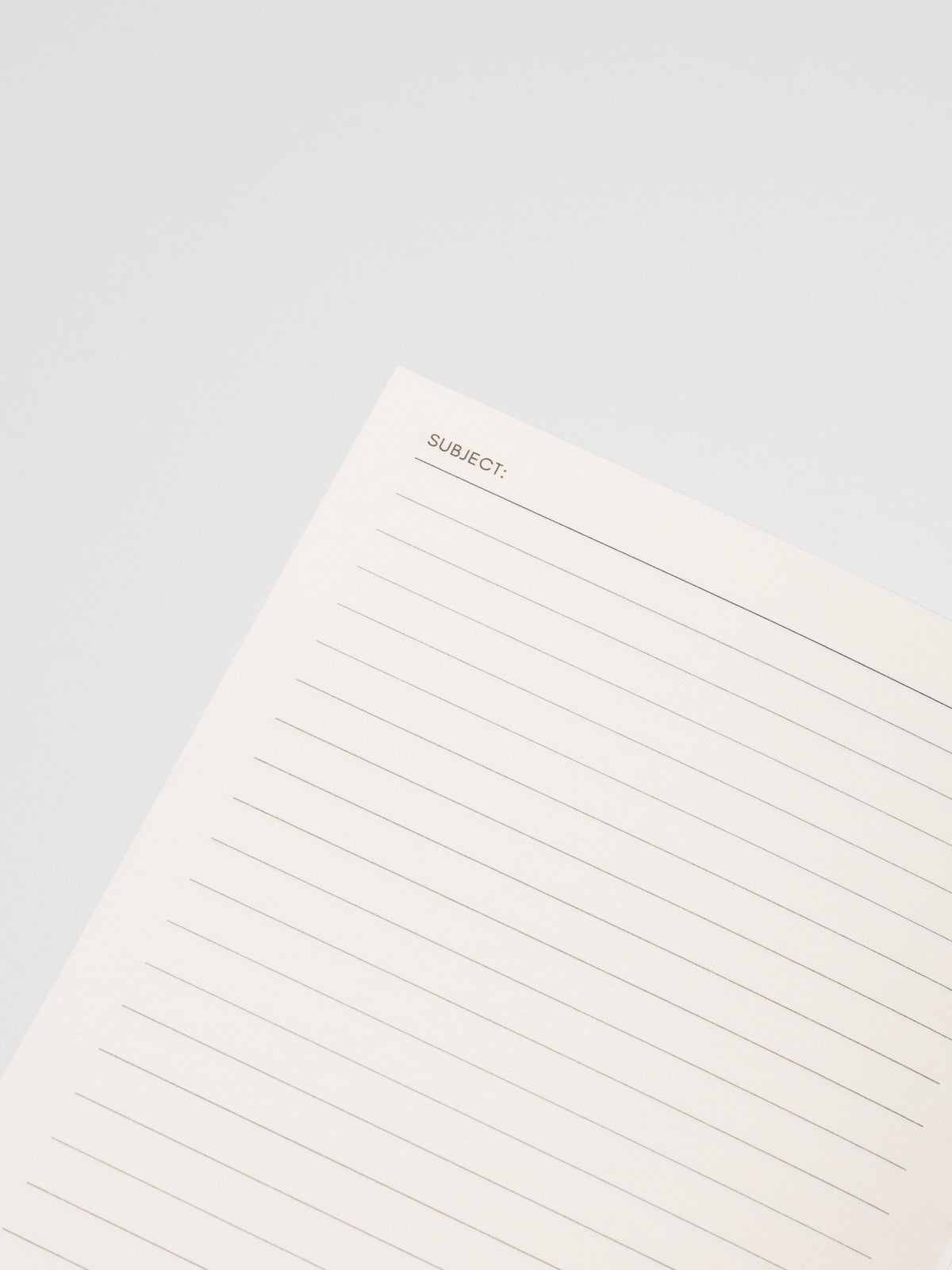 Close up of the Common Thread Notebook showing the white, lined interior pages.