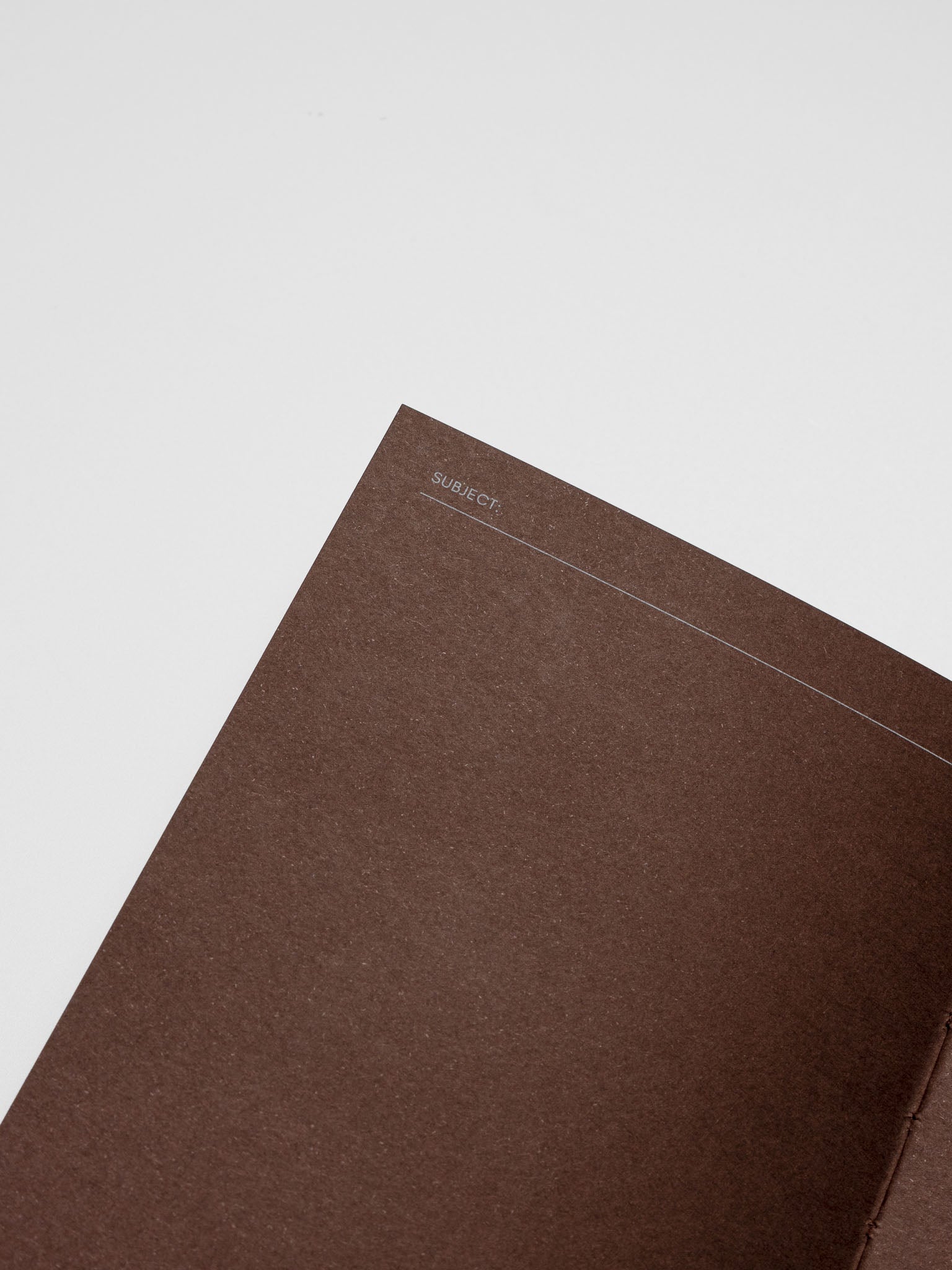 Close up of the Common Thread Notebook showing the brown, blank interior pages.