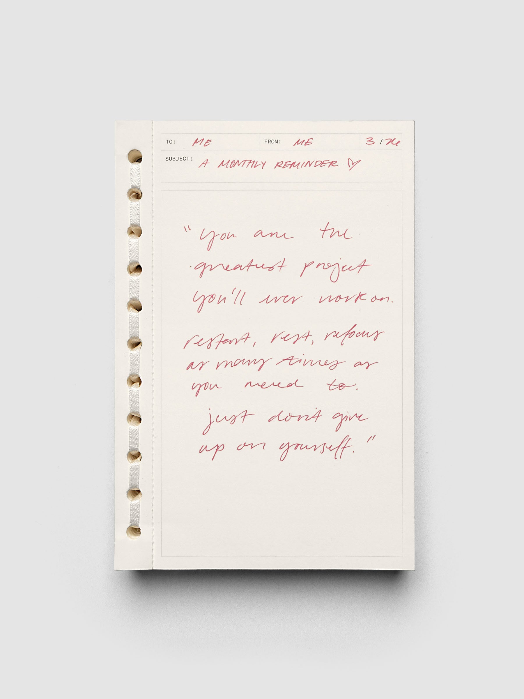 Message pad shown with red handwritten notes.