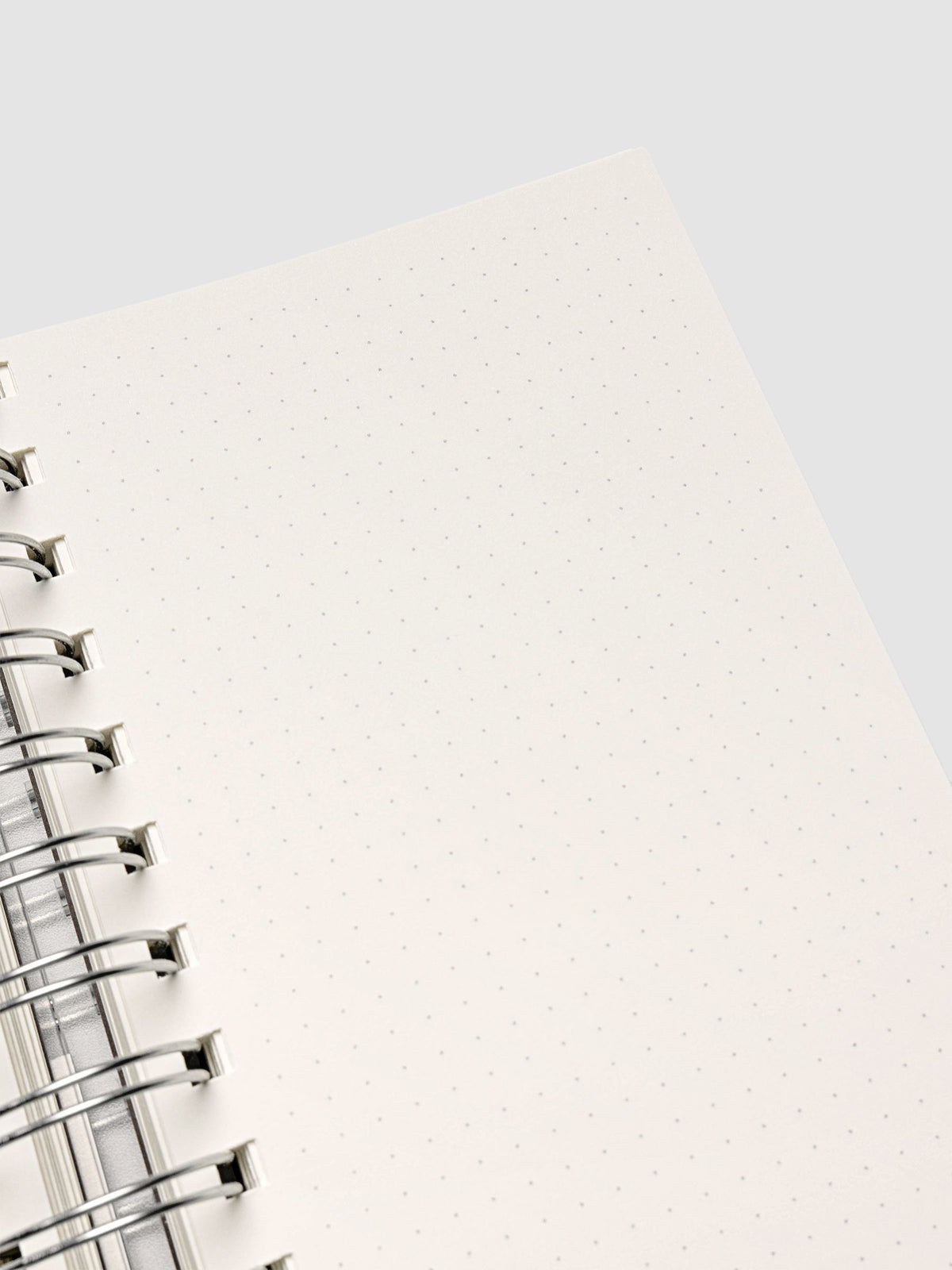 Spiral Notebook in size CP Petite with Dot Grid interior showing close up of right page.