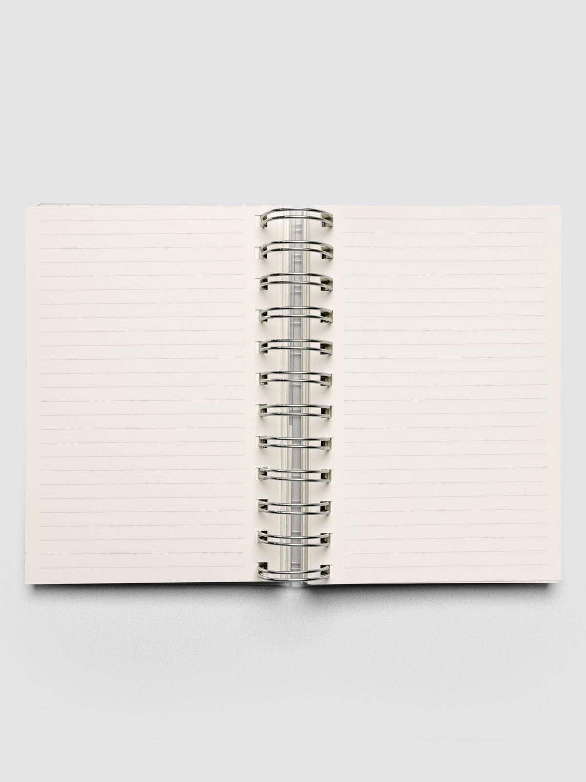 Spiral Notebook in size CP Petite with Lined Notes interior shown open displaying both left and right pages.