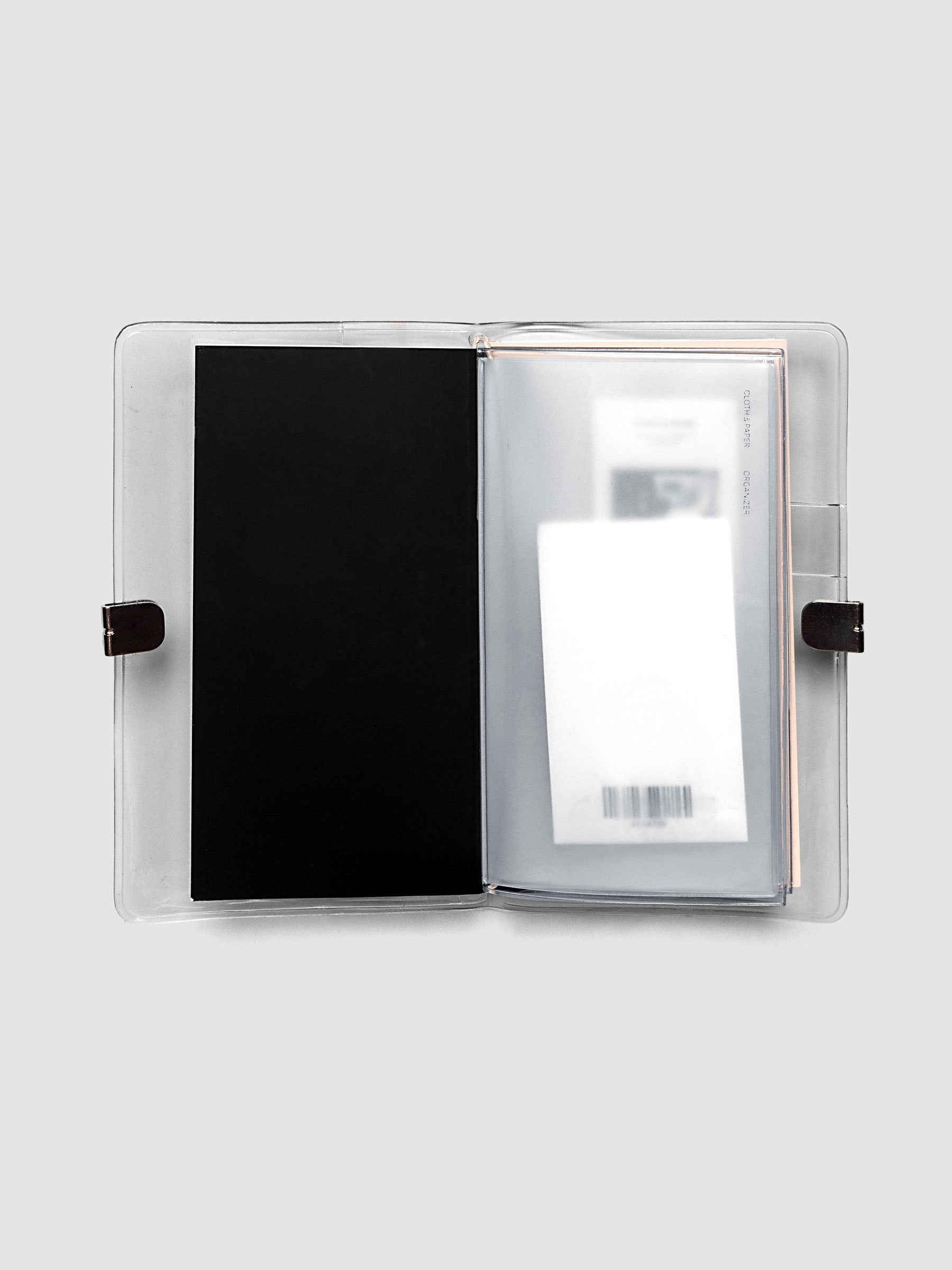 Close up view of Pocket Plus sized clear organizer for stickers or ephemera with a clear vinyl cover.