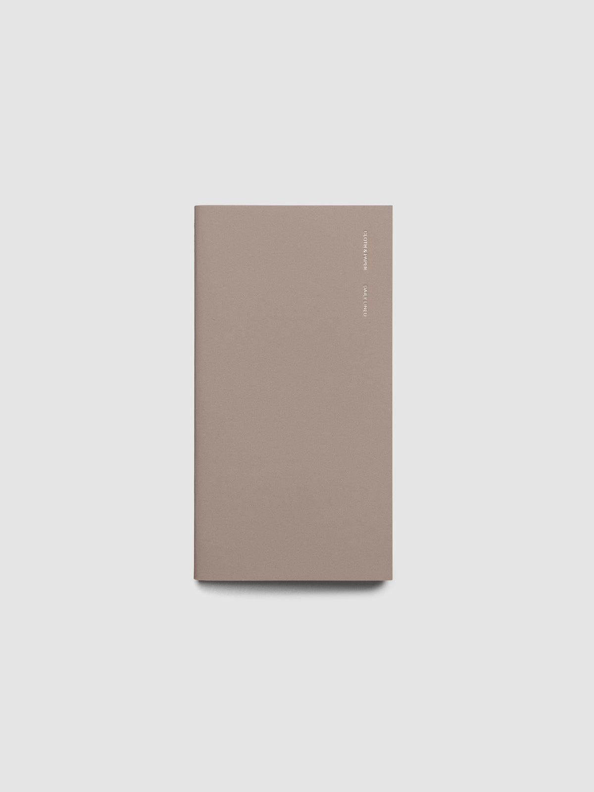 Exterior of a beige pocket plus sized travel notebook.