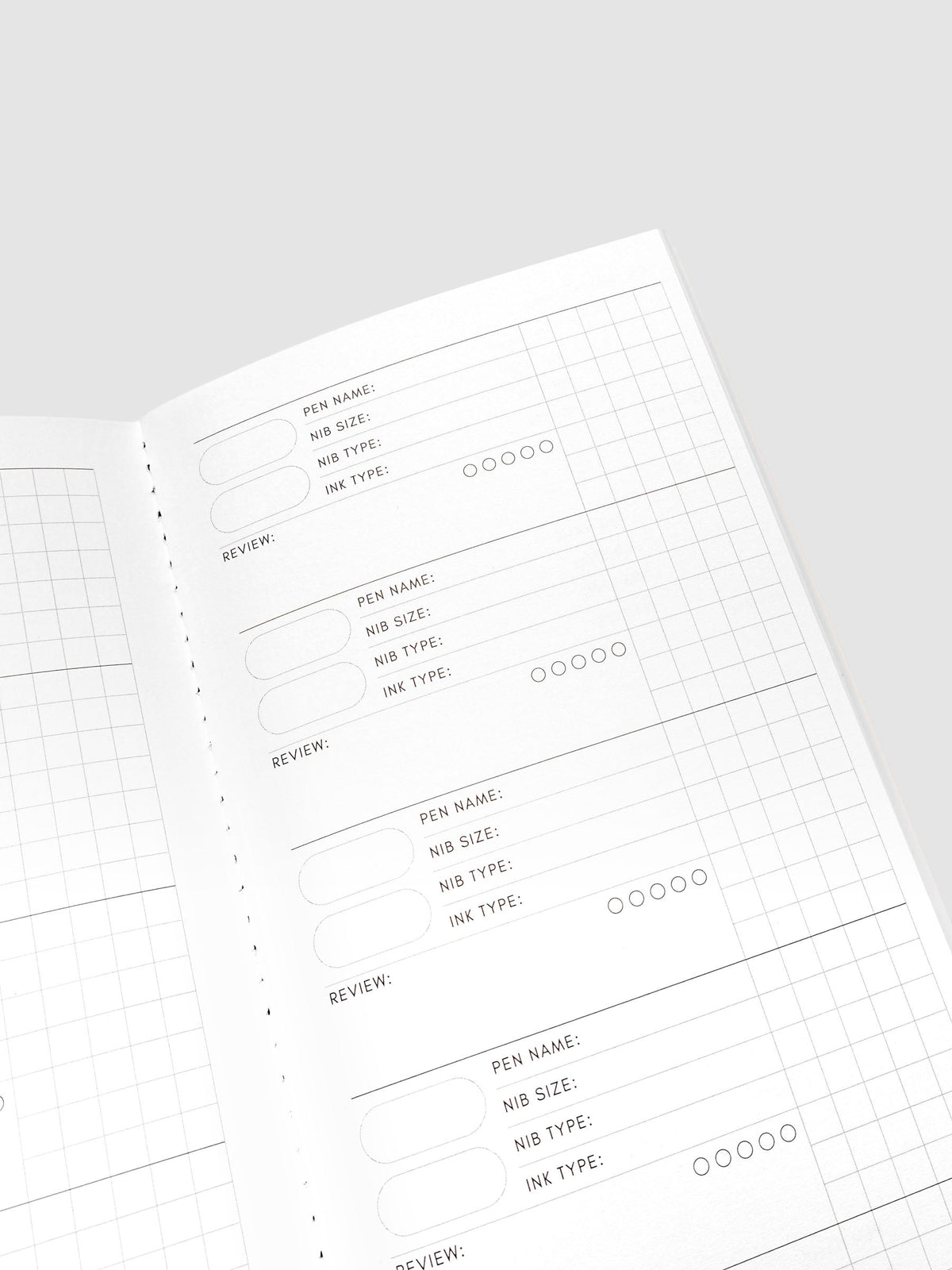Travel Notebook Pen Swatch A5 Slim in Merlot, close up angled view of interior swatch fields with grid paper