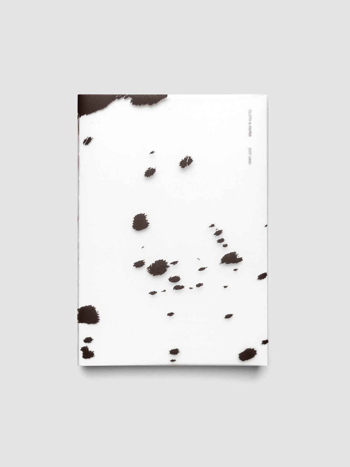 A5 frosted plastic notebook cover with brown dalmatian animal print pattern on a Perfect Bound Notebook