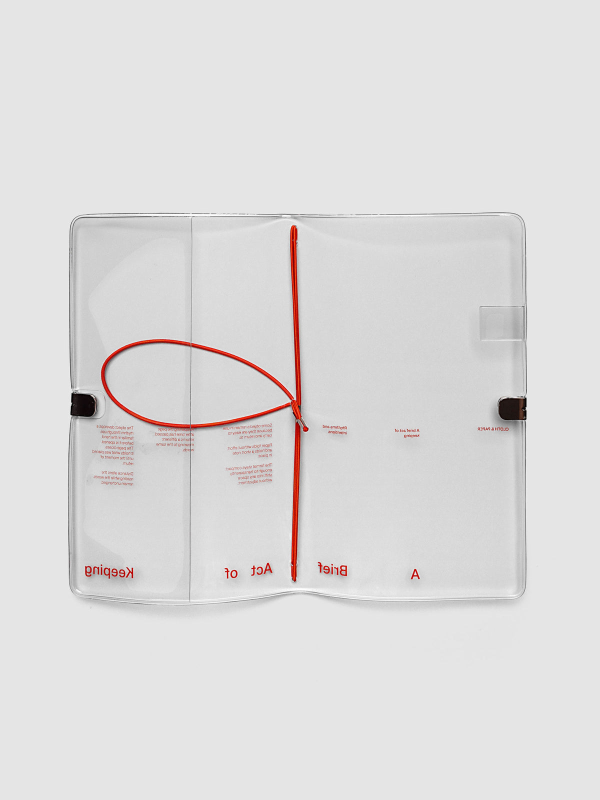 Act of Keeping Travel Notebook Cover in A5 Slim size, open, showing four deep orange interior bands, pen loop, and front pocket