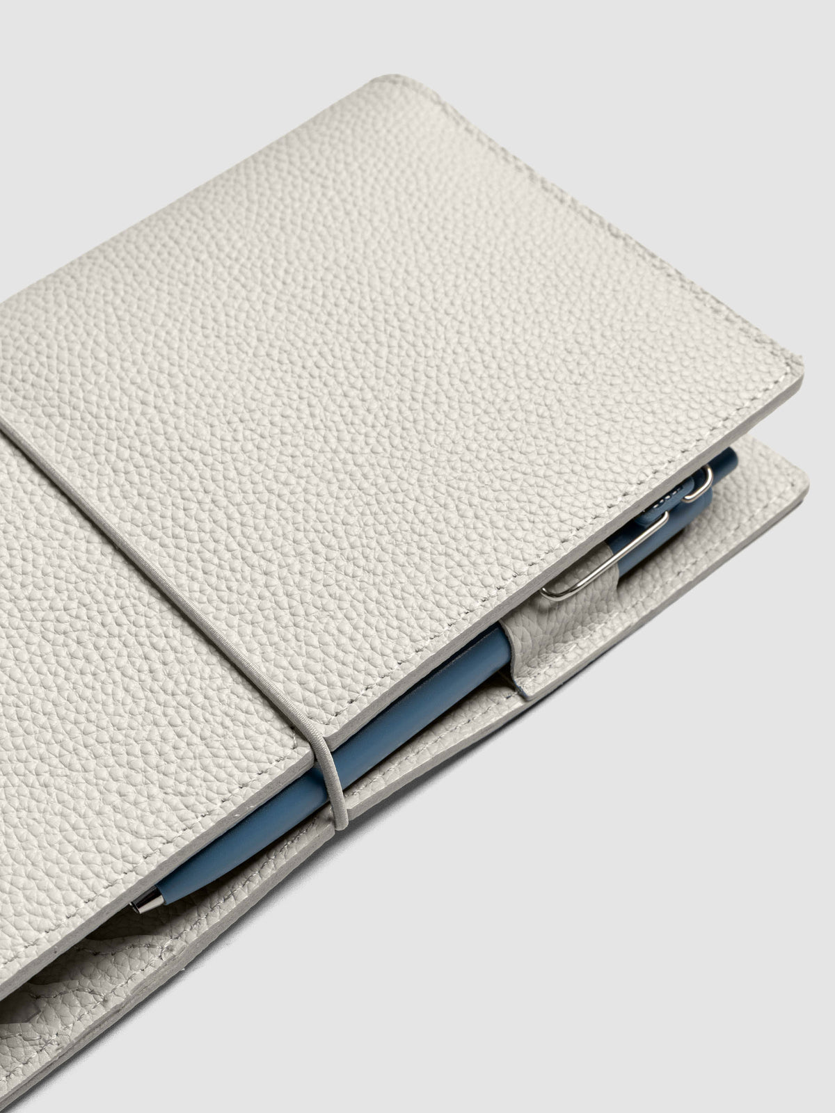 Light grey leather travel notebook cover in size A5 Slim shown closed.