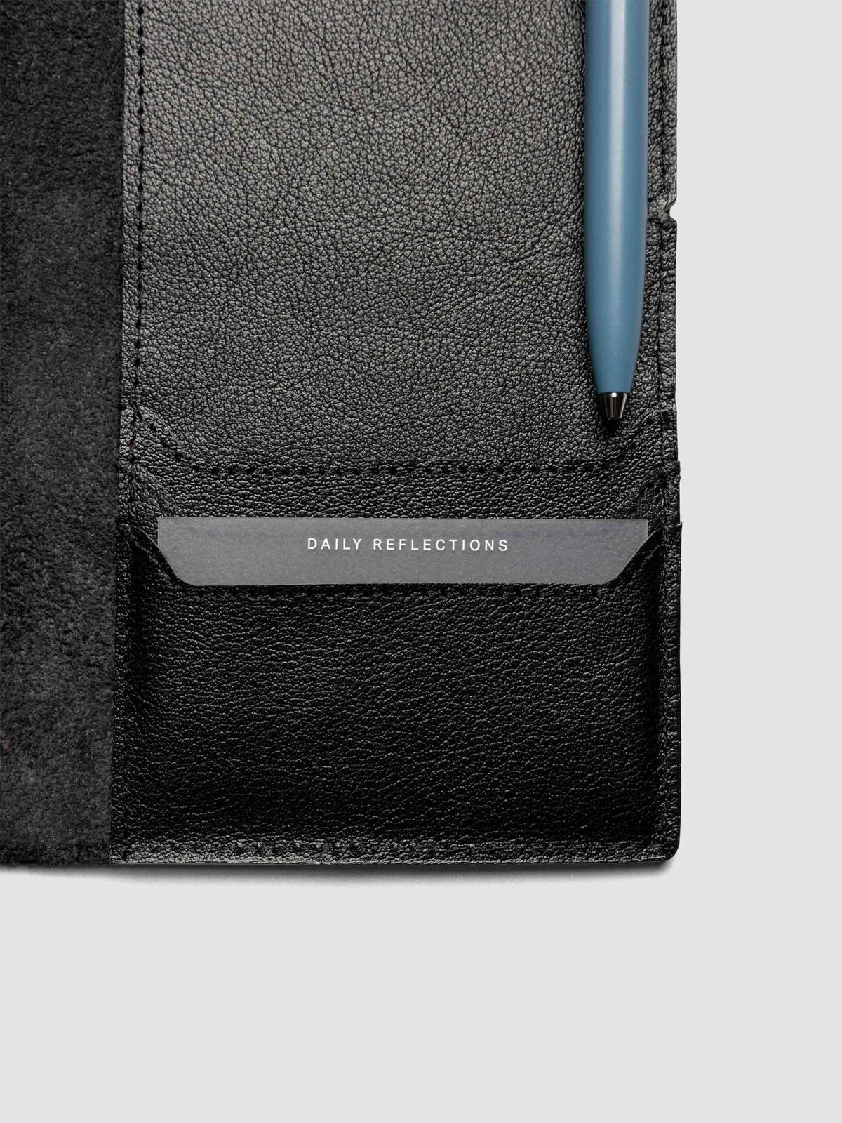 Black leather travel notebook cover in size A5 Slim showing interior credit card pockets.