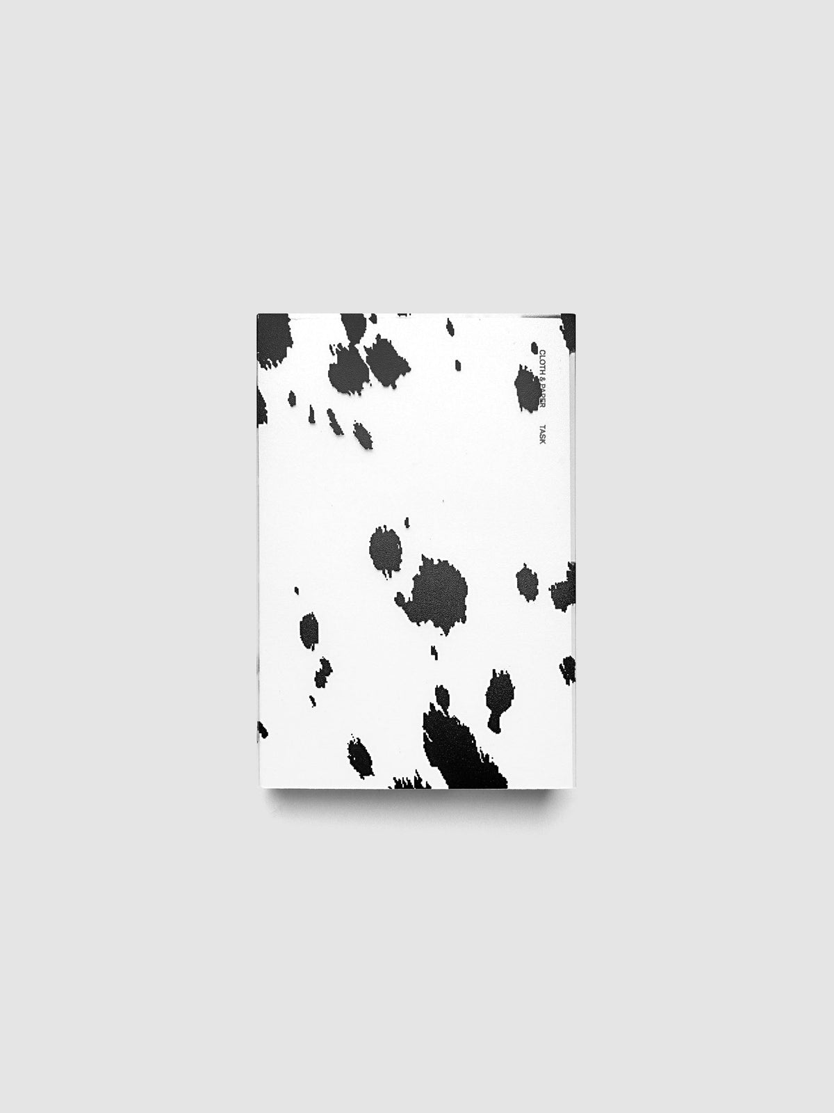 CP Petite frosted plastic notebook cover with black dalmatian animal print pattern on a Perfect Bound Notebook