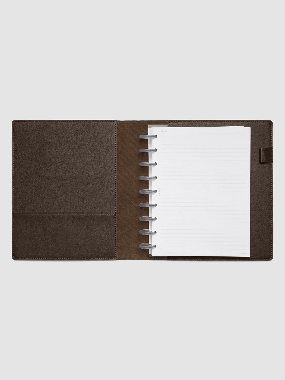 Dark brown leather planner folio with an HP Classic discbound planner inside.