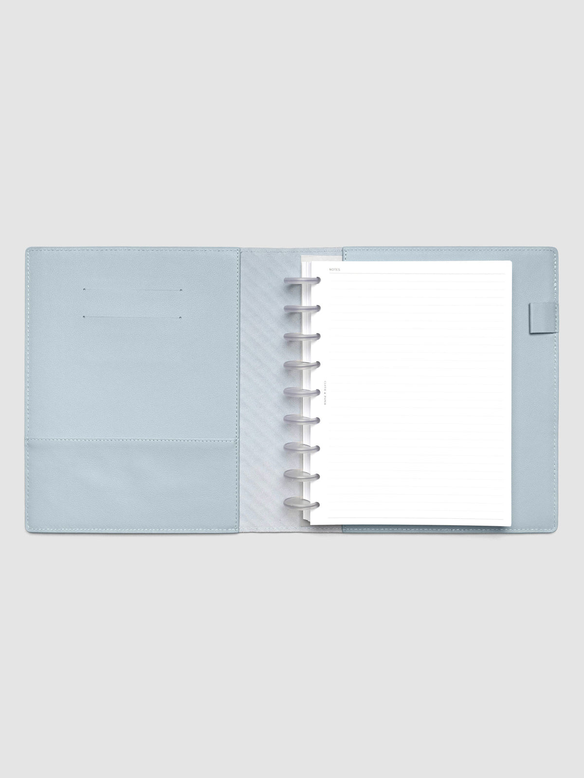 Blue leather planner folio with an HP Classic discbound planner inside.