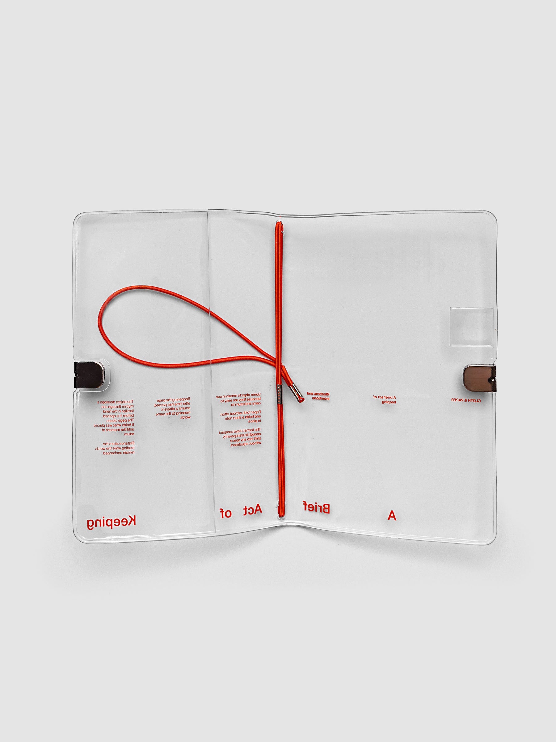 Act of Keeping Travel Notebook Cover in Pocket Plus size, open, showing four deep orange interior bands, pen loop, and front pocket