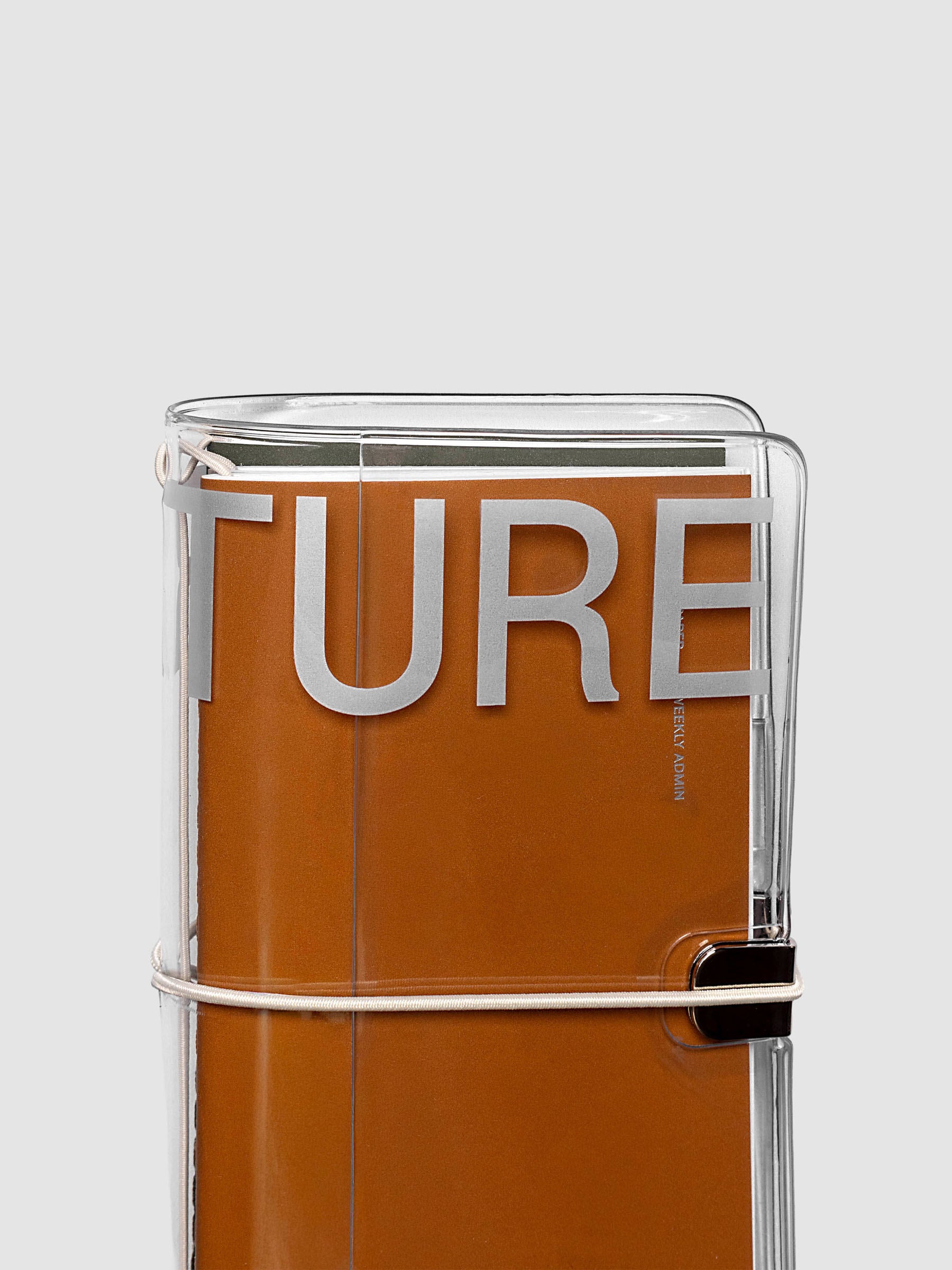 Close-up of the top of the Aperture Travel Notebook Cover in Pocket Plus size with travel notebooks inside, showing grey band detail