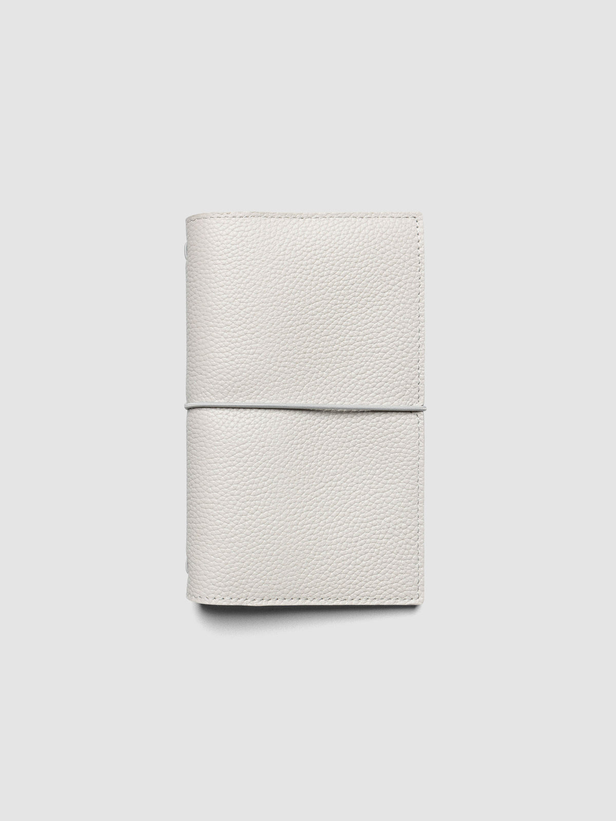 Light grey genuine leather travel notebook cover shown in size Pocket Plus.