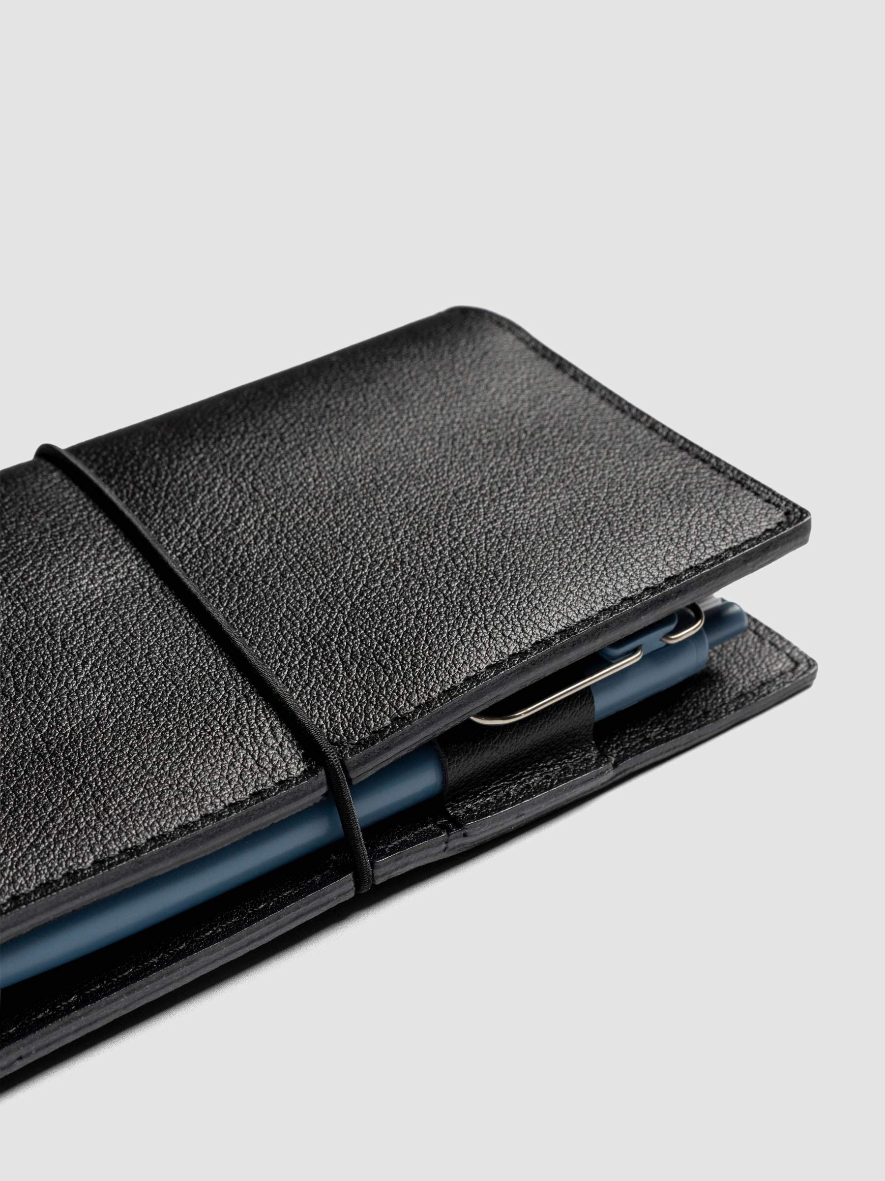 Black leather travel notebook cover in size Pocket Plus shown closed.