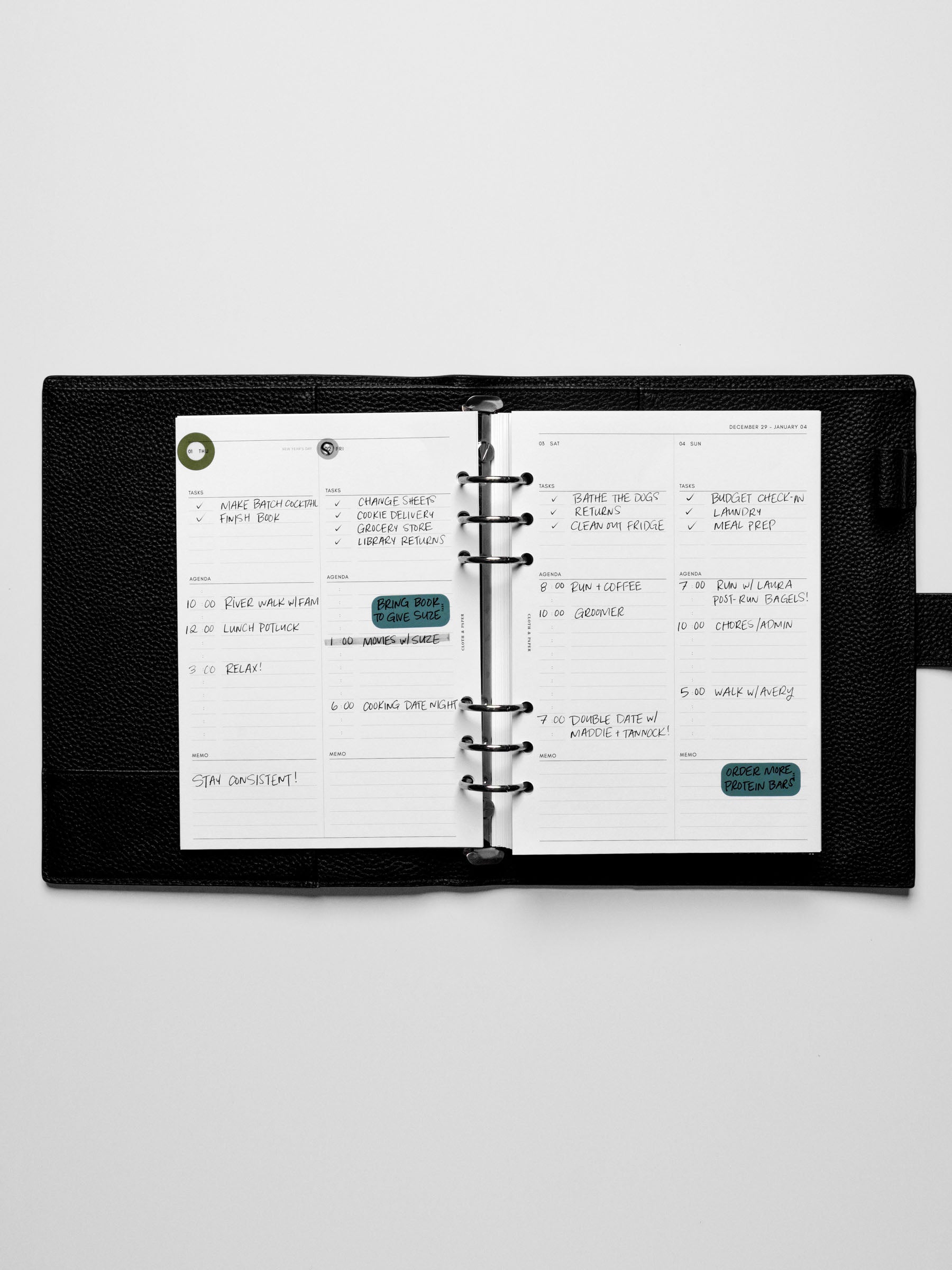 Image shows the Monday Start 2026 Dated Daily Planner Insert in a black leather ring-bound planner.