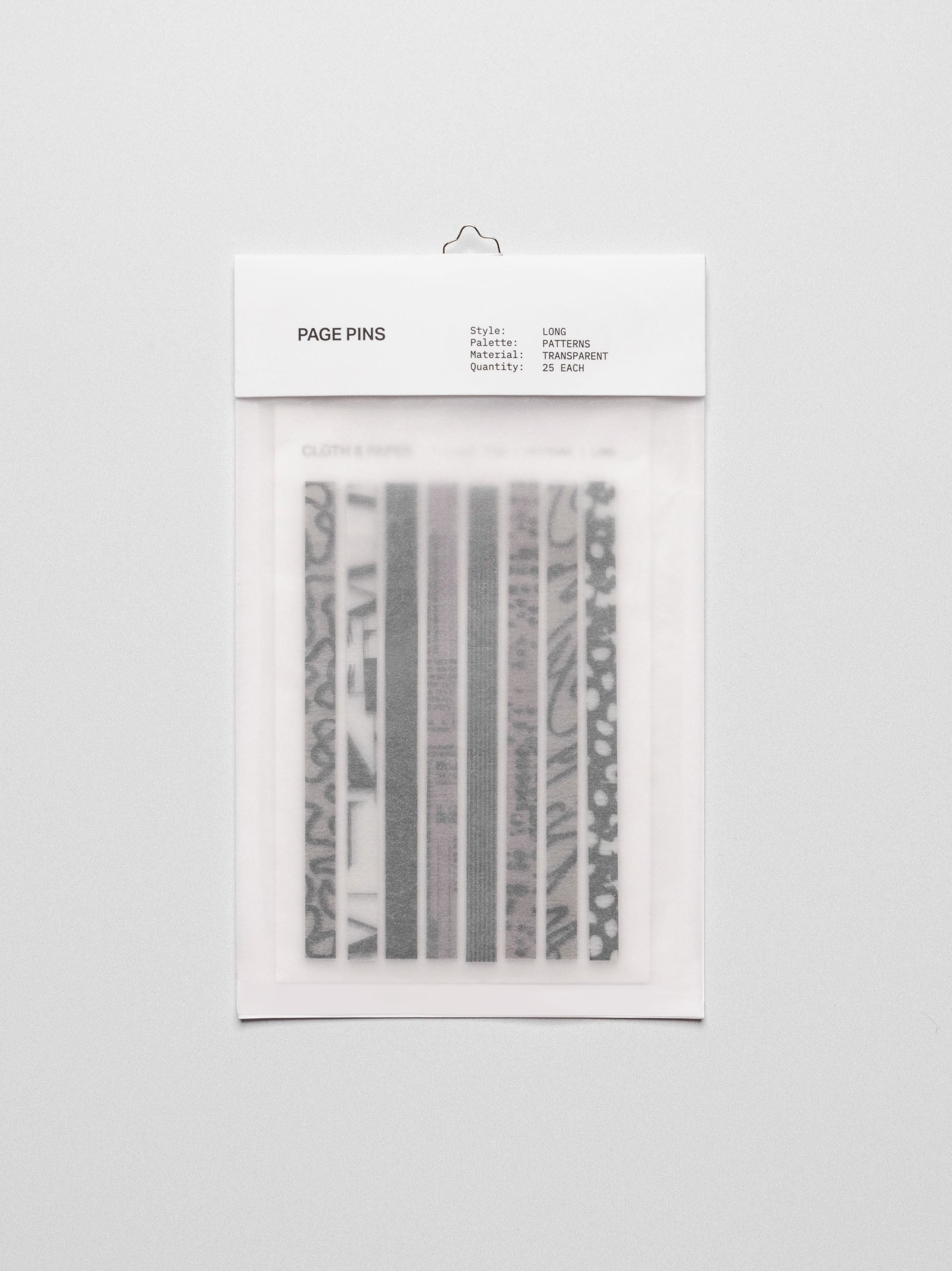 Long page pins displayed in their packaging on a neutral background.