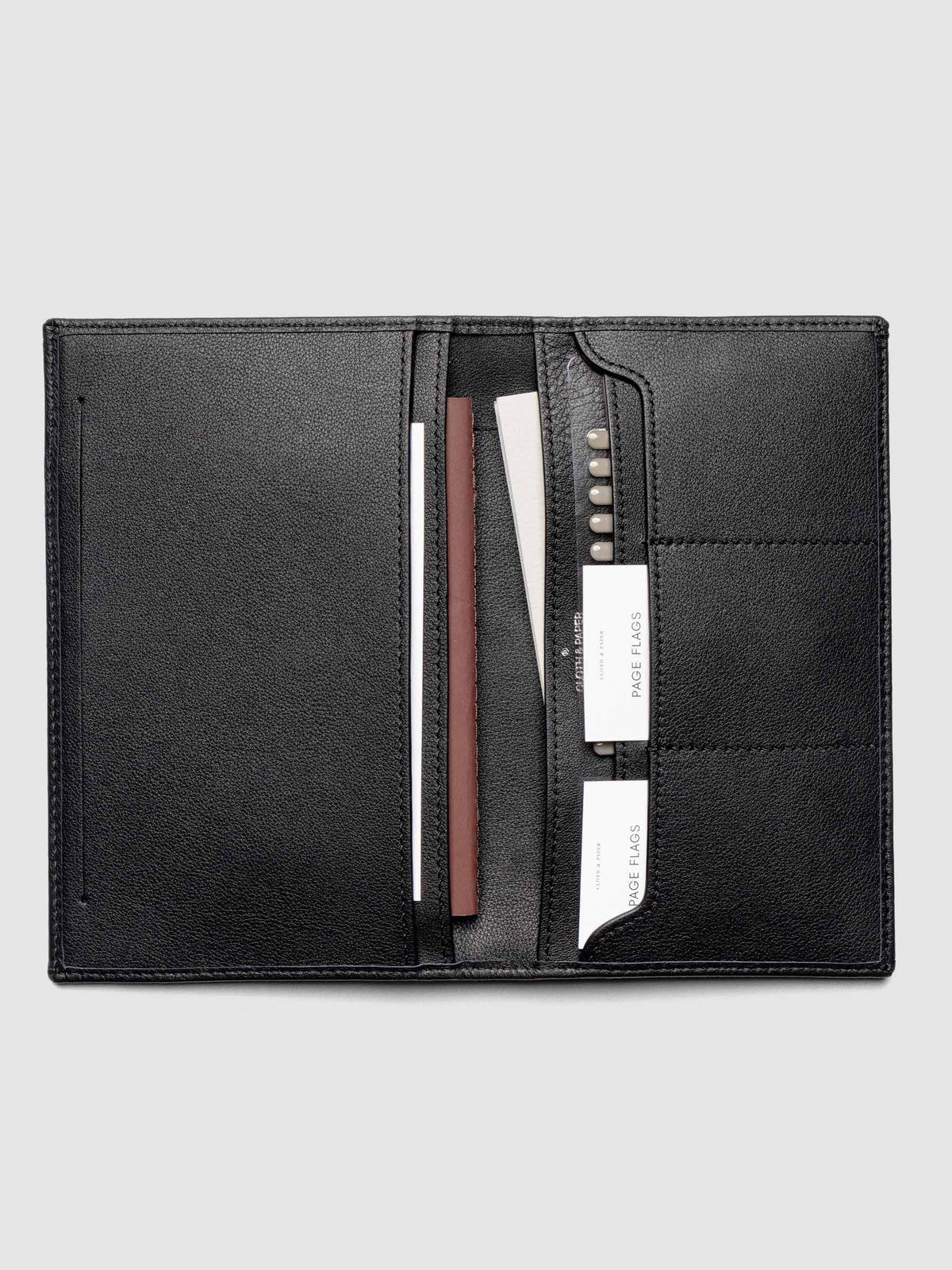 Nomada Wallet in Padrillo open with Cloth & Paper products in pockets, full product view