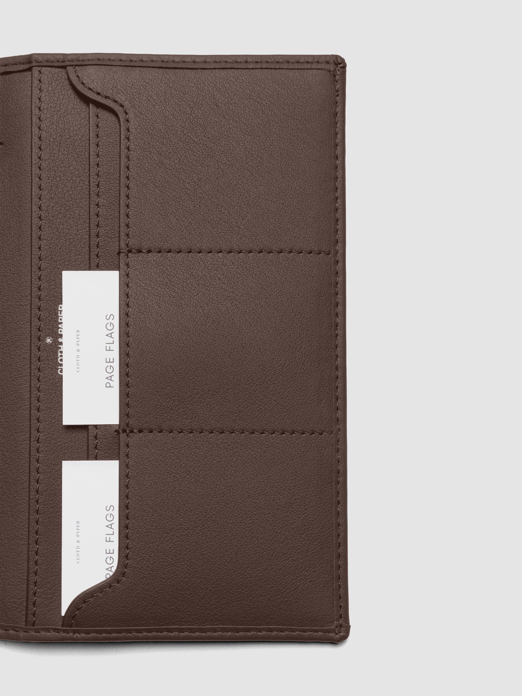 Close-up of Nomada Wallet credit card slots in Cordoba with page flags tucked inside
