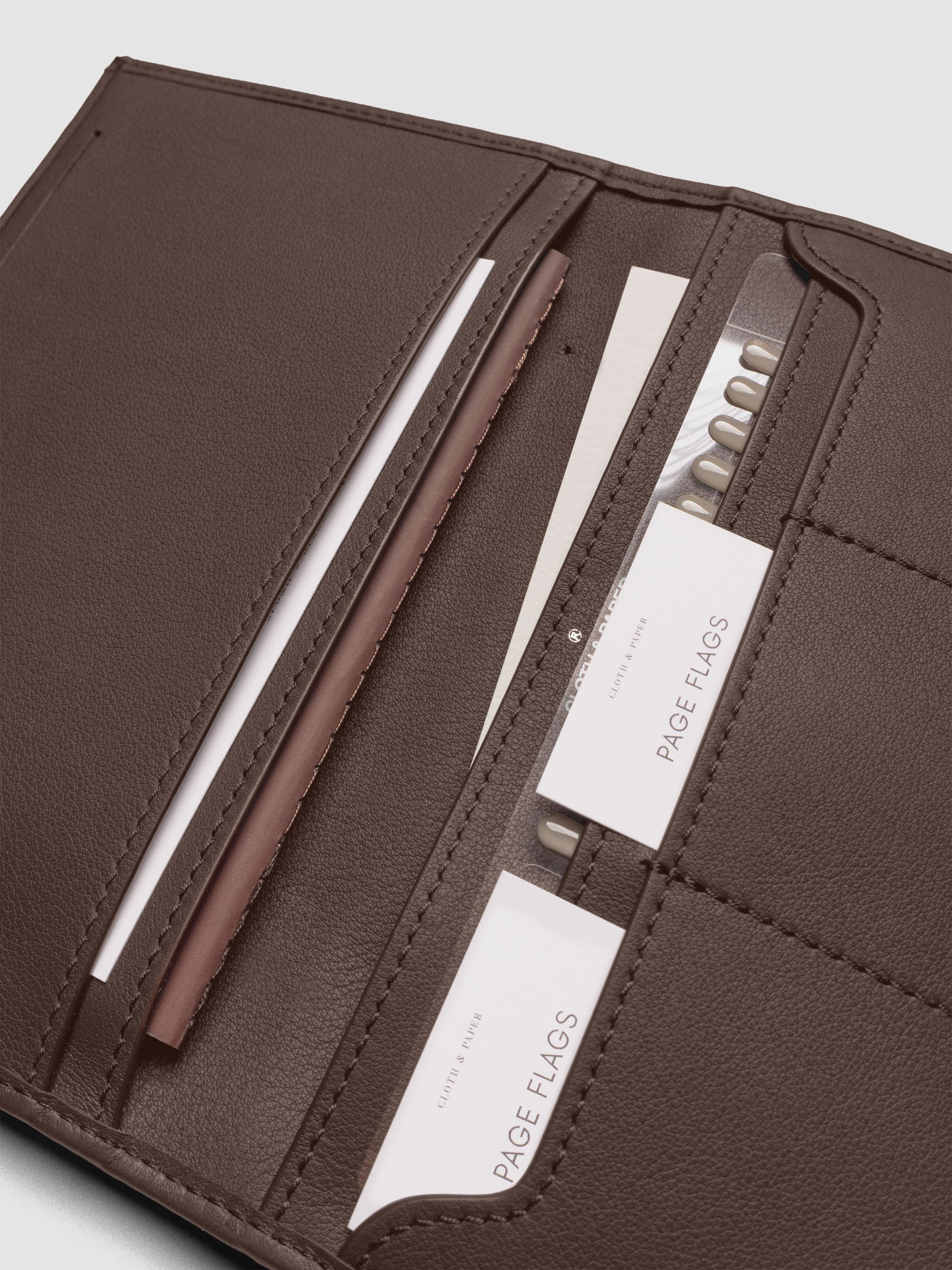 Nomada Wallet in Cordoba open with Cloth & Paper products in pockets, full product view
