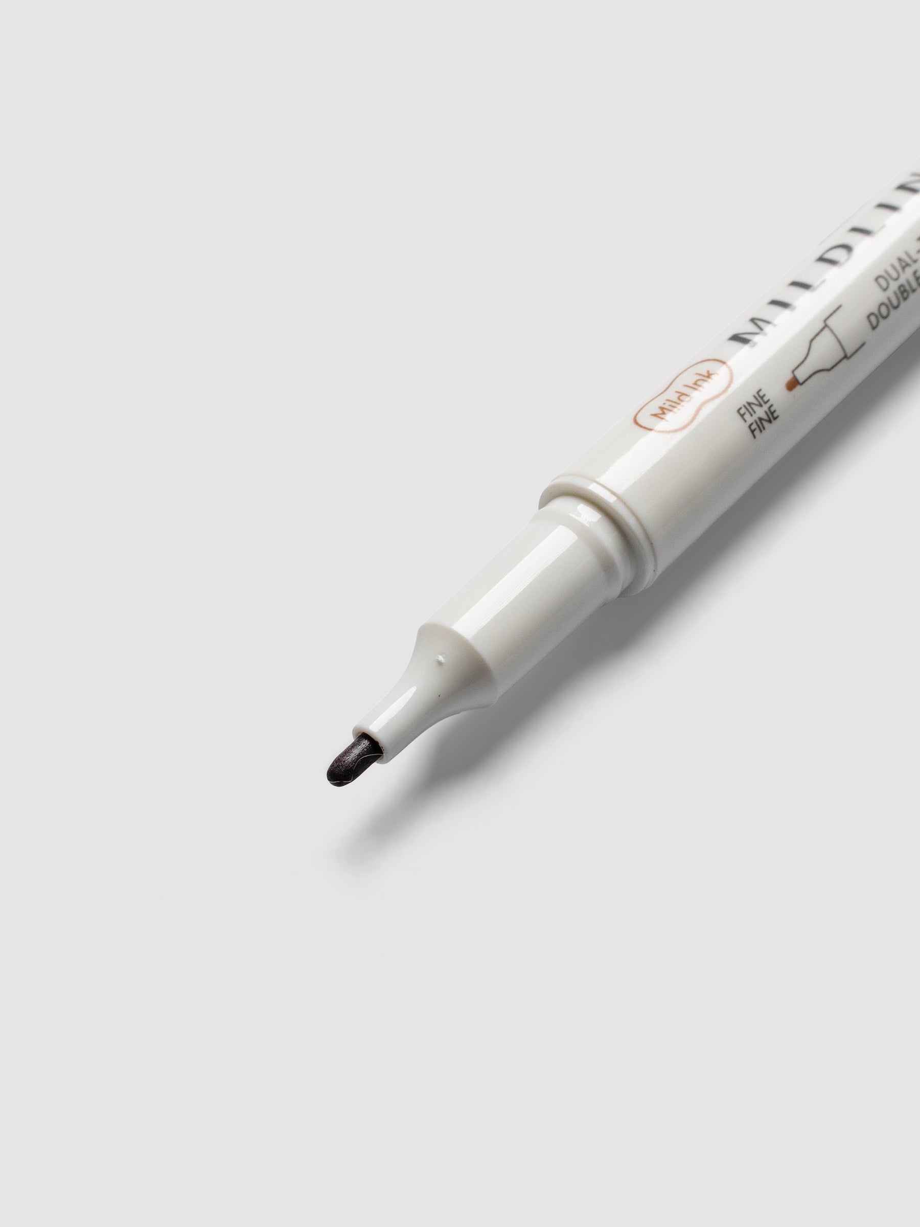 Close-up of Zebra Mildliner Dual-Tip Fineliner fine bullet tip in brown