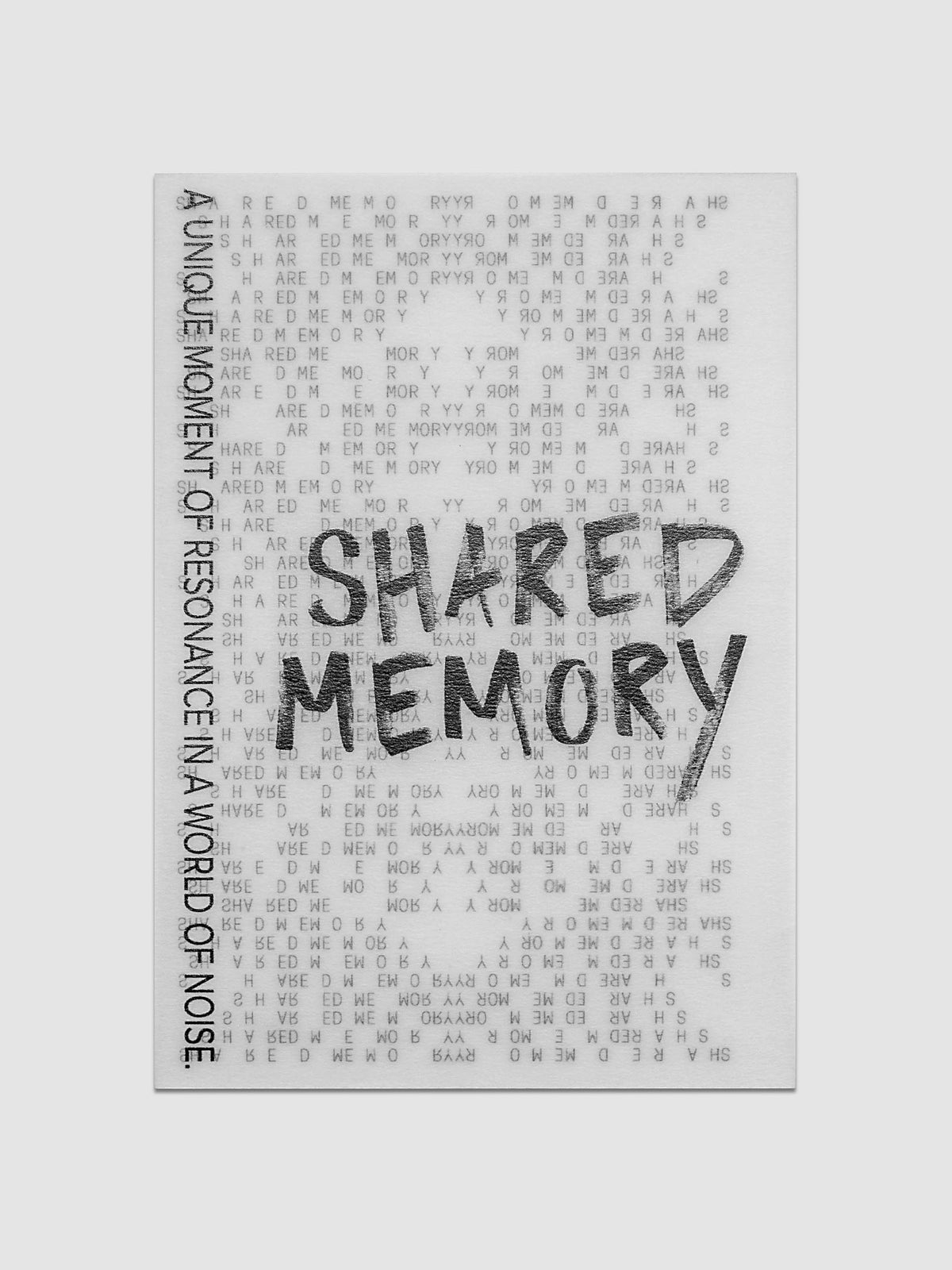 Translucent vellum journaling card with a black printed text design reading "Shared Memory".