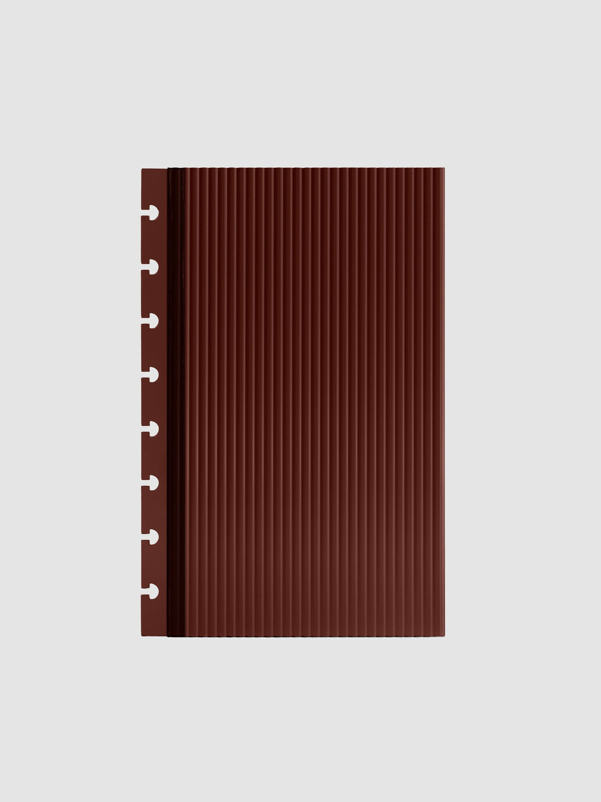 Bordeaux fluted planner dashboard in Half Letter size, eight disc punch, shown flat on a grey background.
