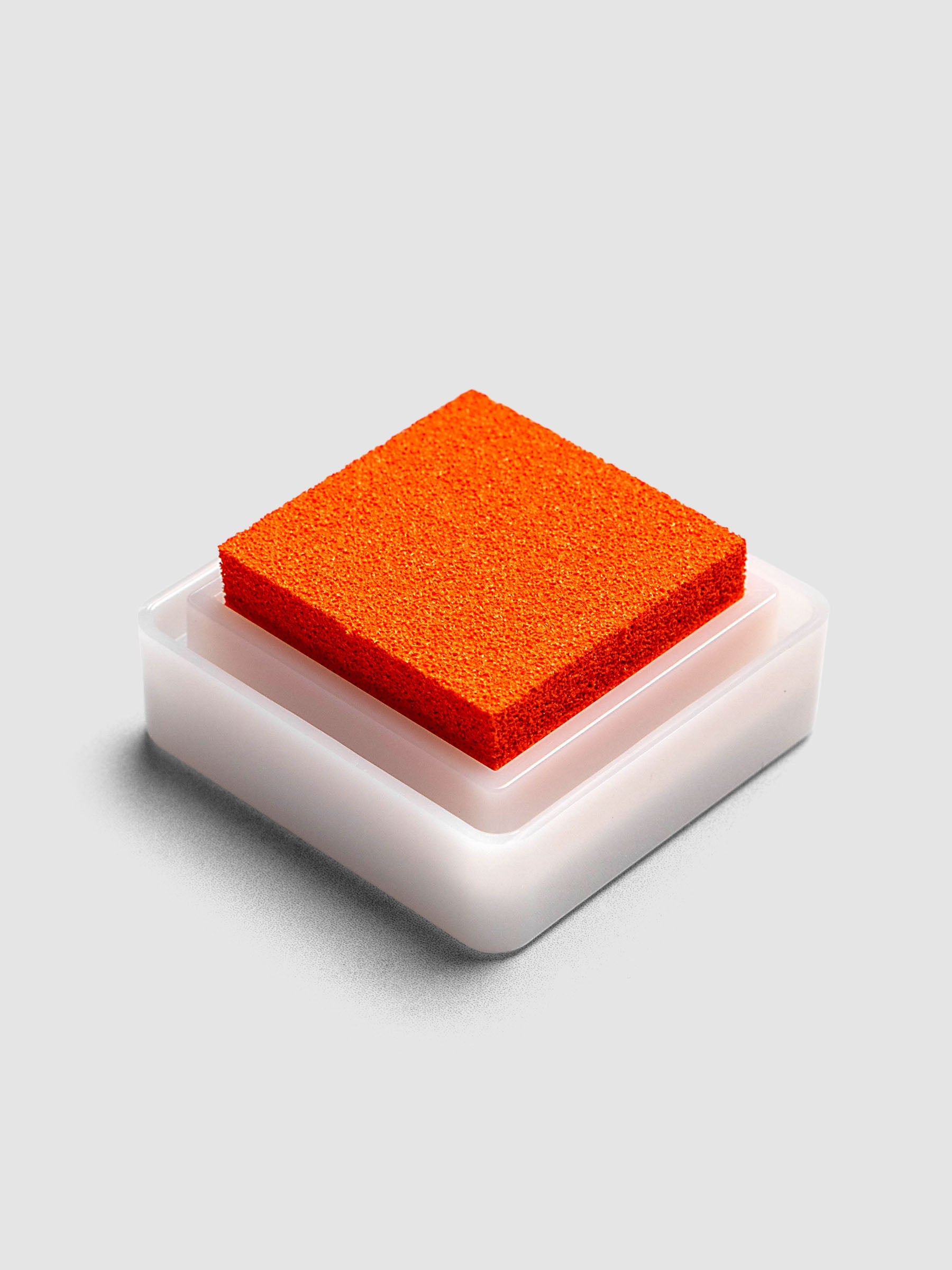 Artnic Stamp Ink Pad in orange seen from the side with cover removed