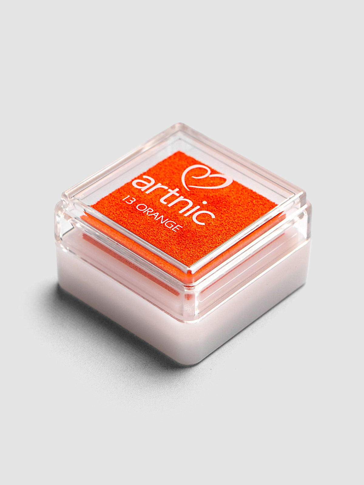 Artnic Stamp Ink Pad in orange seen from the side with cover on