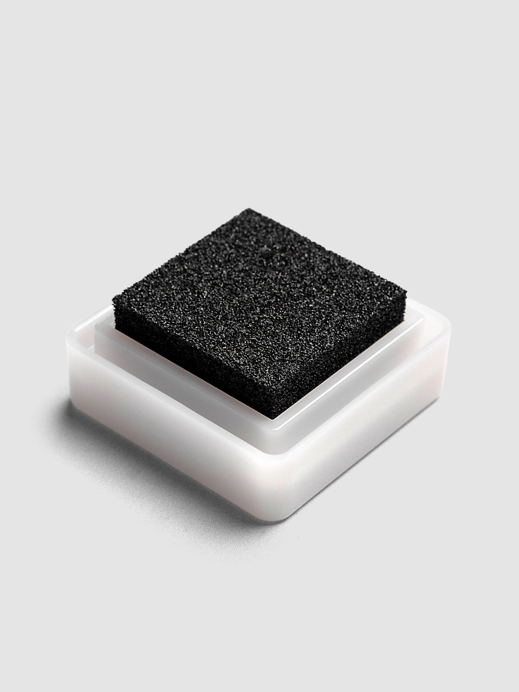 Artnic Stamp Ink Pad in charcoal seen from the side with cover removed