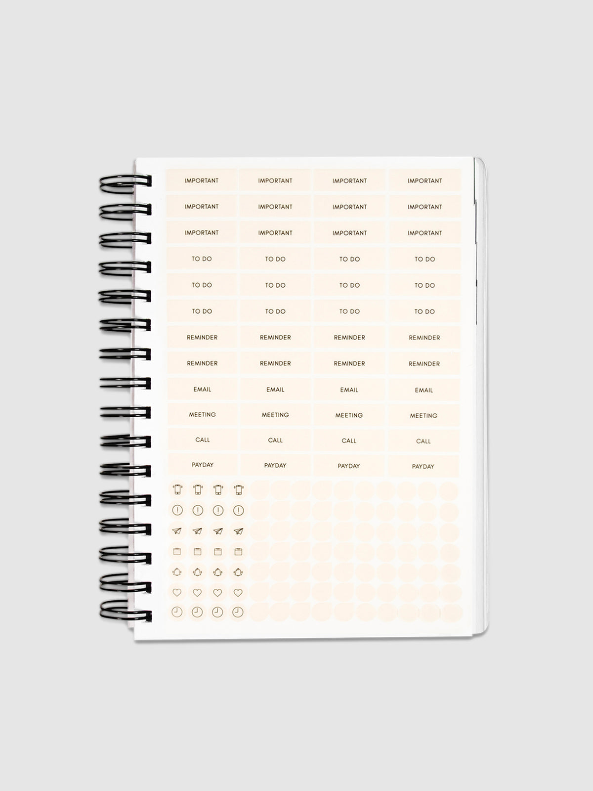 Planner Stickers in a 2022 Spiral Bound Planner on a neutral background