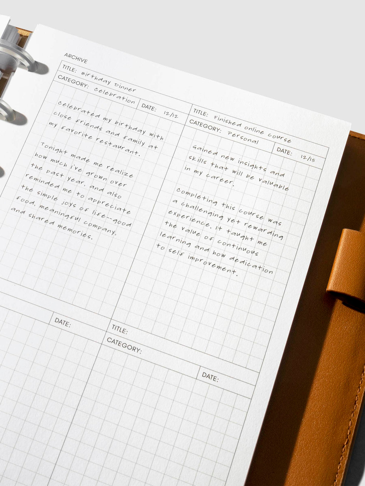 Closeup of inserts in use inside a leather planner.