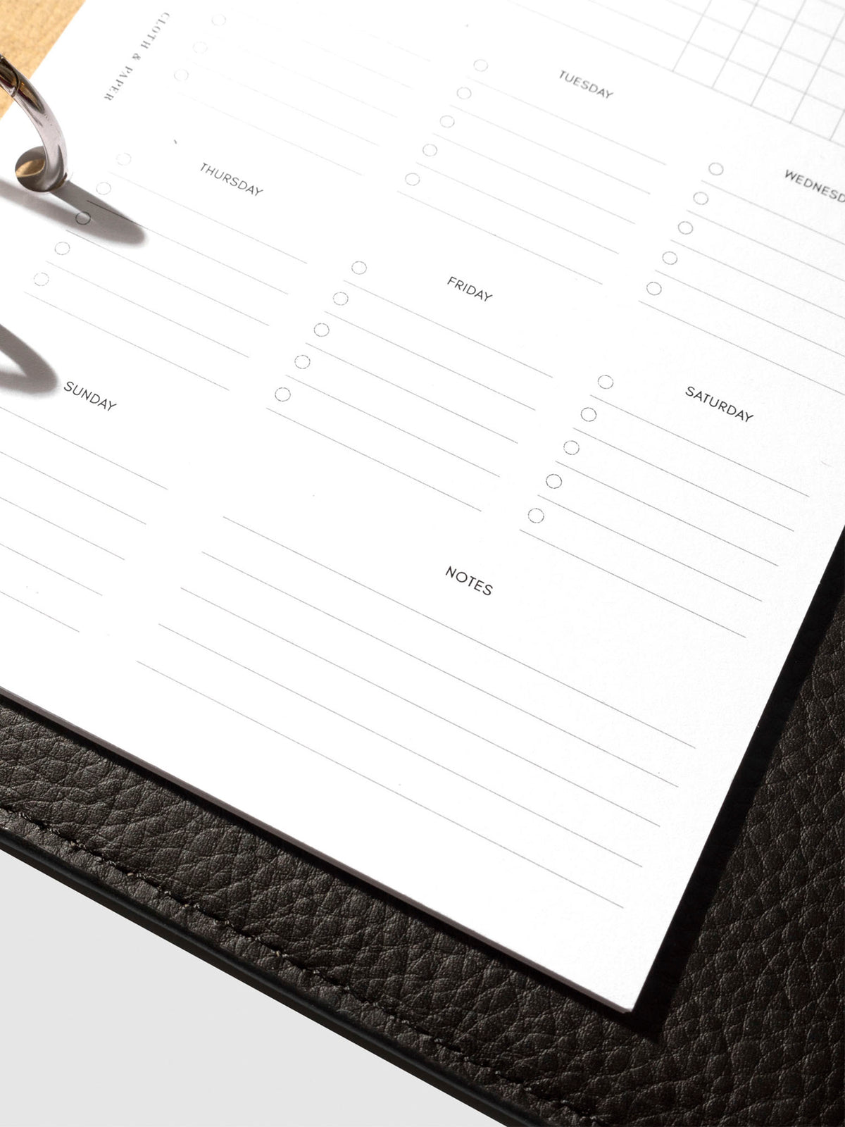 Insert in use inside a black leather planner.