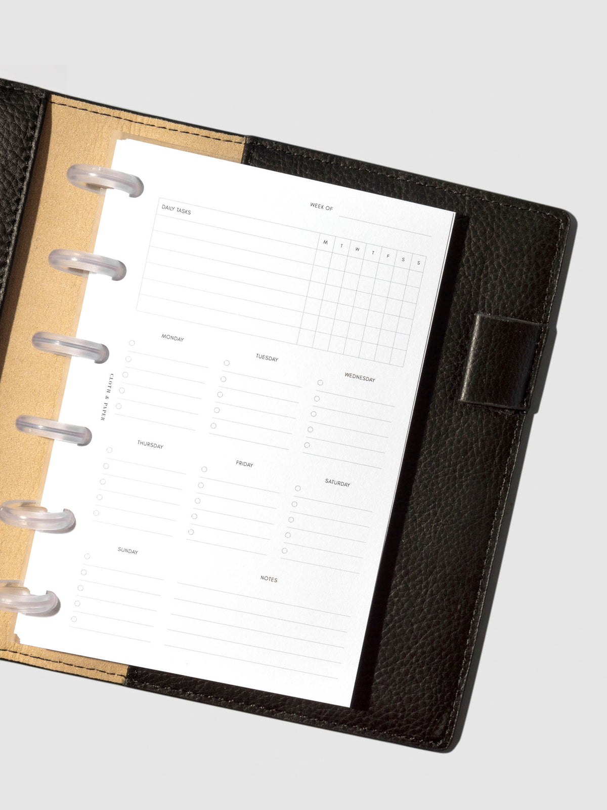 Insert in use inside a black leather planner.