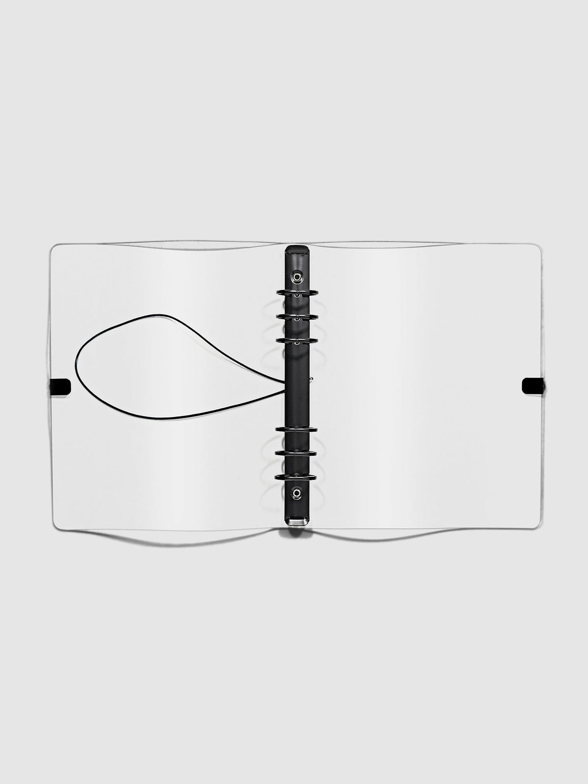 Open clear vinyl 6 ring agenda with black bungee shown open on a neutral background.