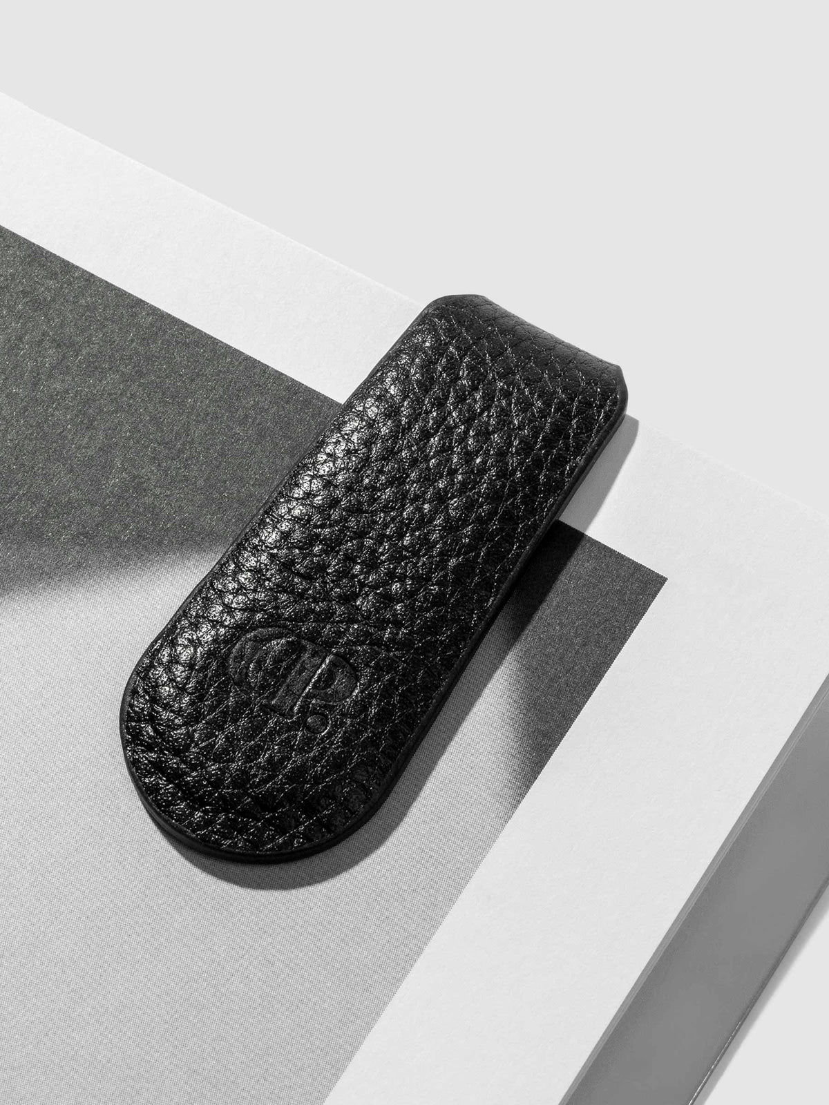 Close up of smooth leather texture on clip. Color shown is black.