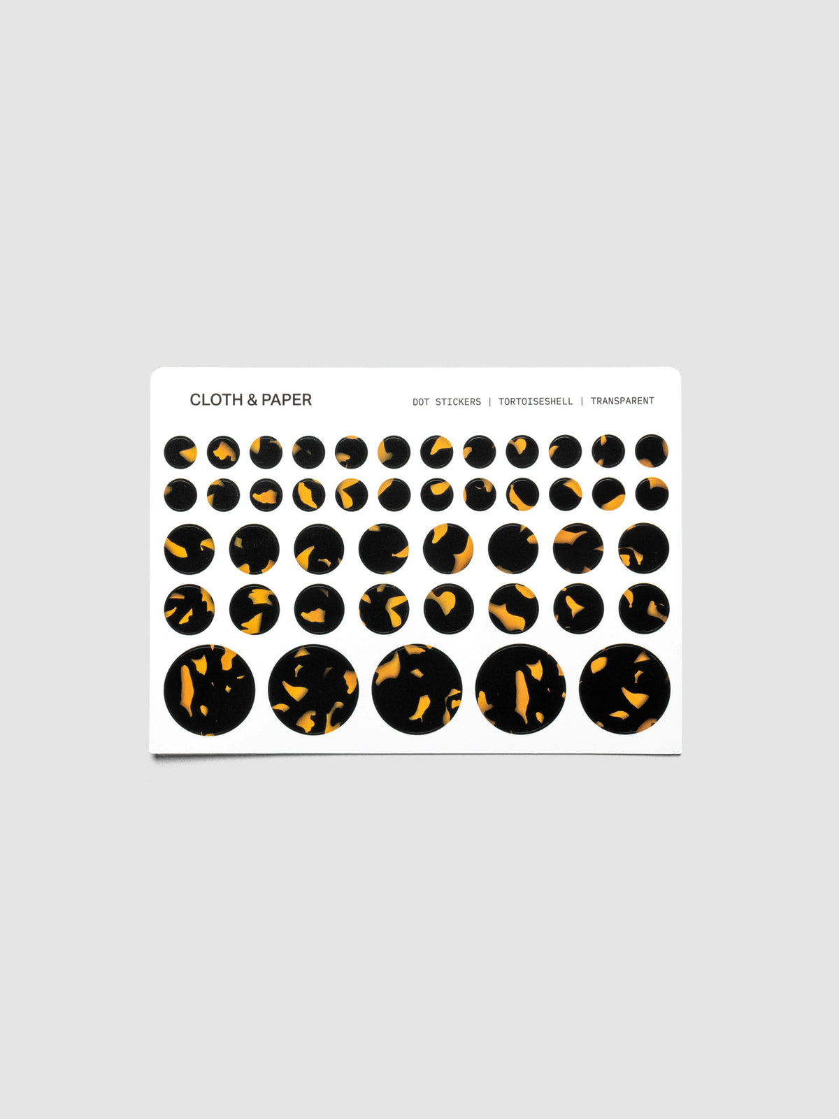 Dot Stickers, Tortoiseshell, Cloth and Paper with small, medium, and large circle stickers shown on one sheet. Stickers displayed on a neutral background.