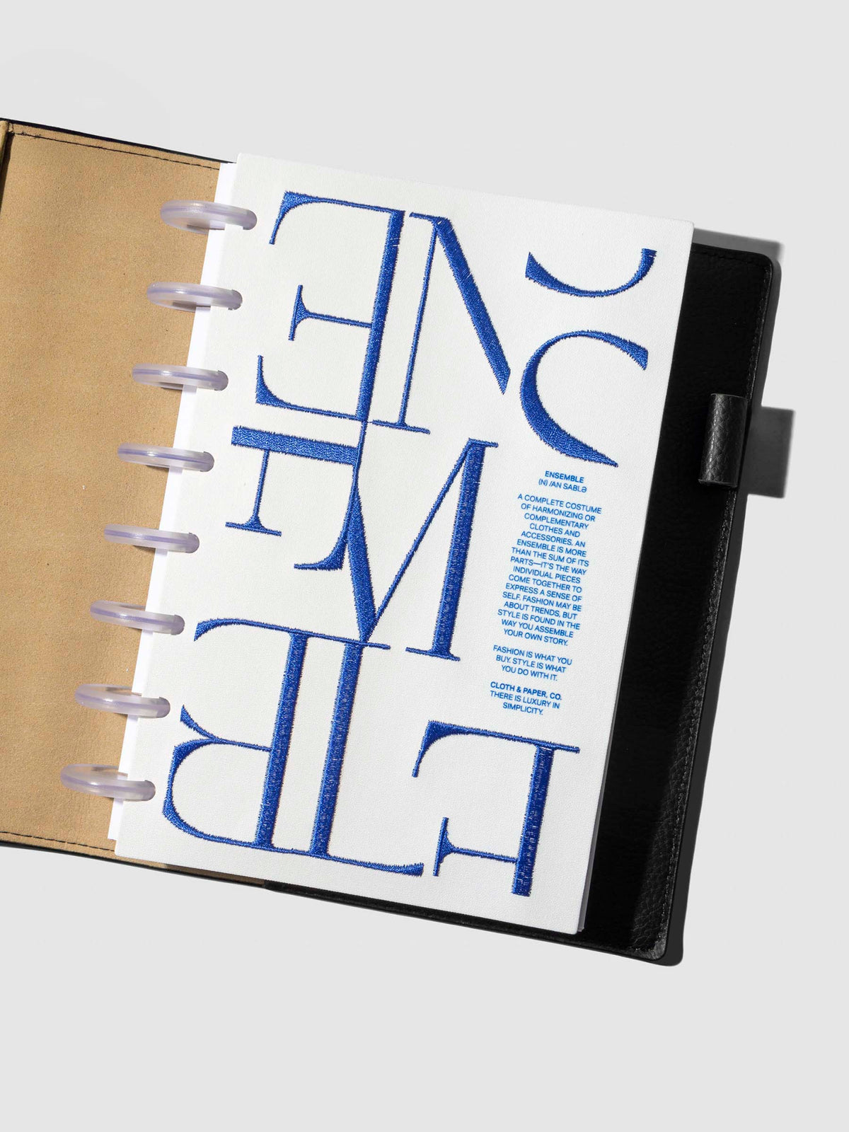 Dashboard displayed inside a leather agenda on a neutral background. Size shown is Half Letter.