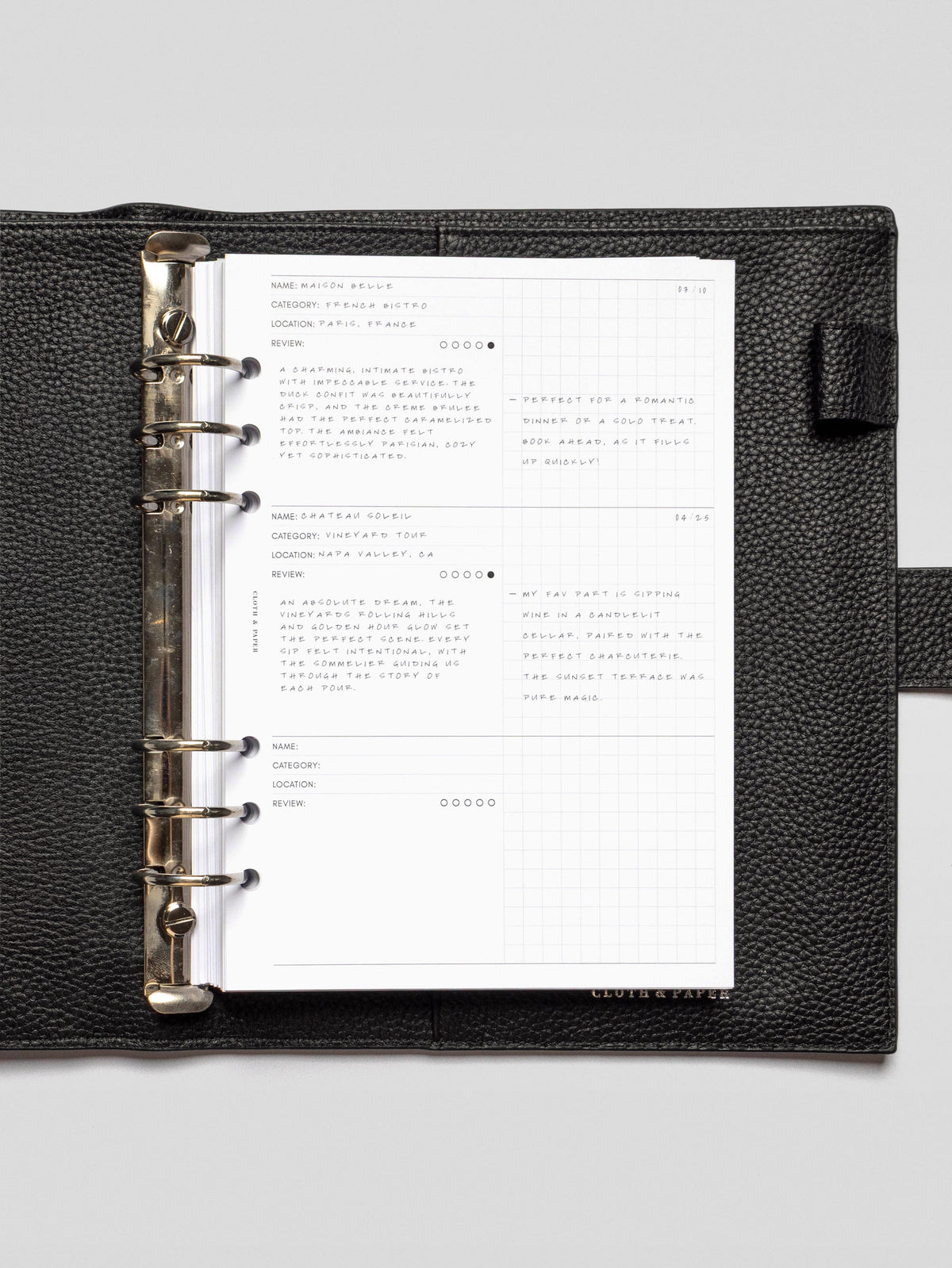 Filled-in demo page of the Experience Tracker Inserts, with handwritten reviews for a French bistro and a vineyard tour, using both the structured and grid sections.