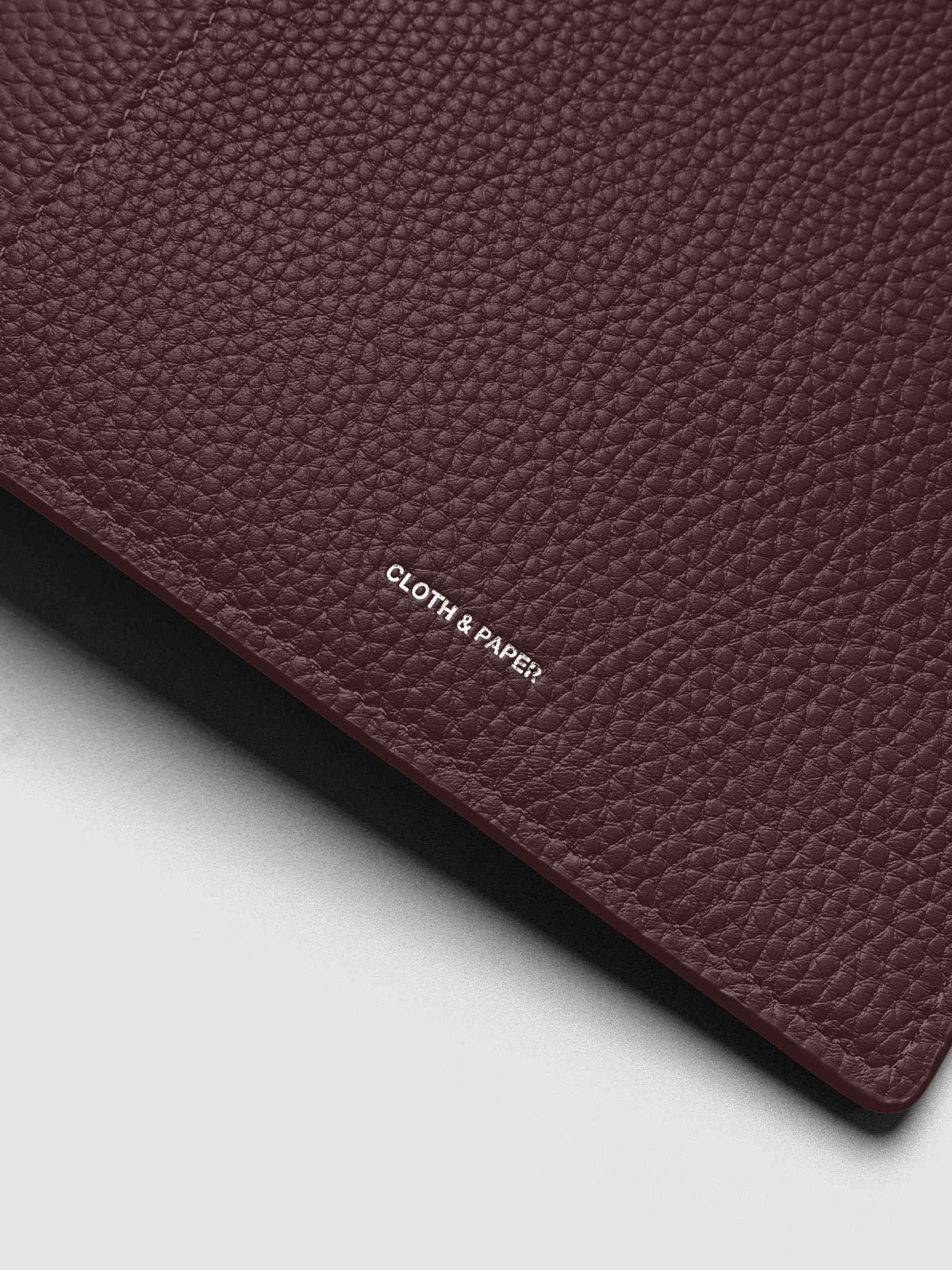 Close up of the Leather Agenda with silver Cloth & Paper logo embossing.