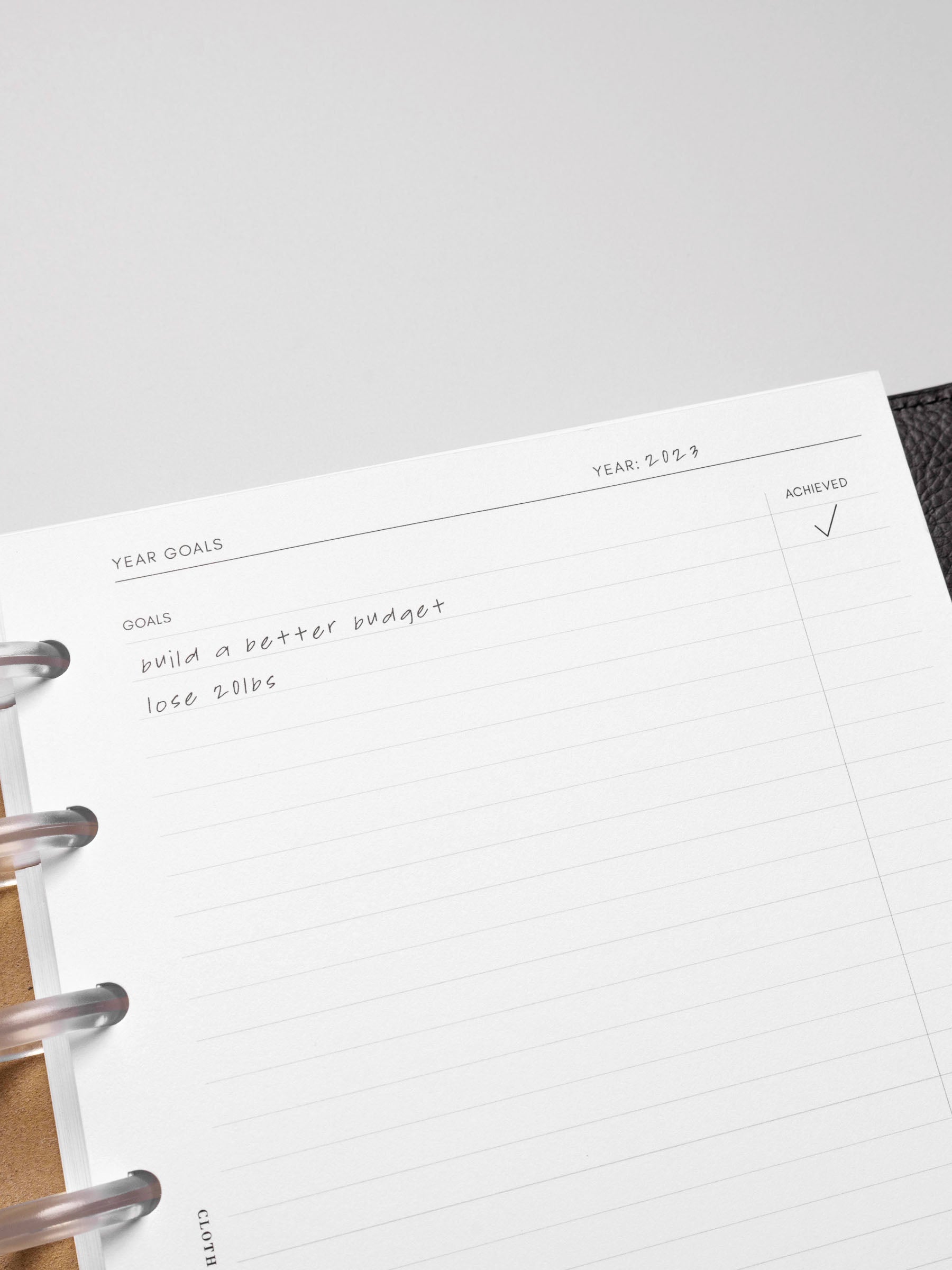 Close up of Goal Mapping inserts inside discbound planner and leather cover. 