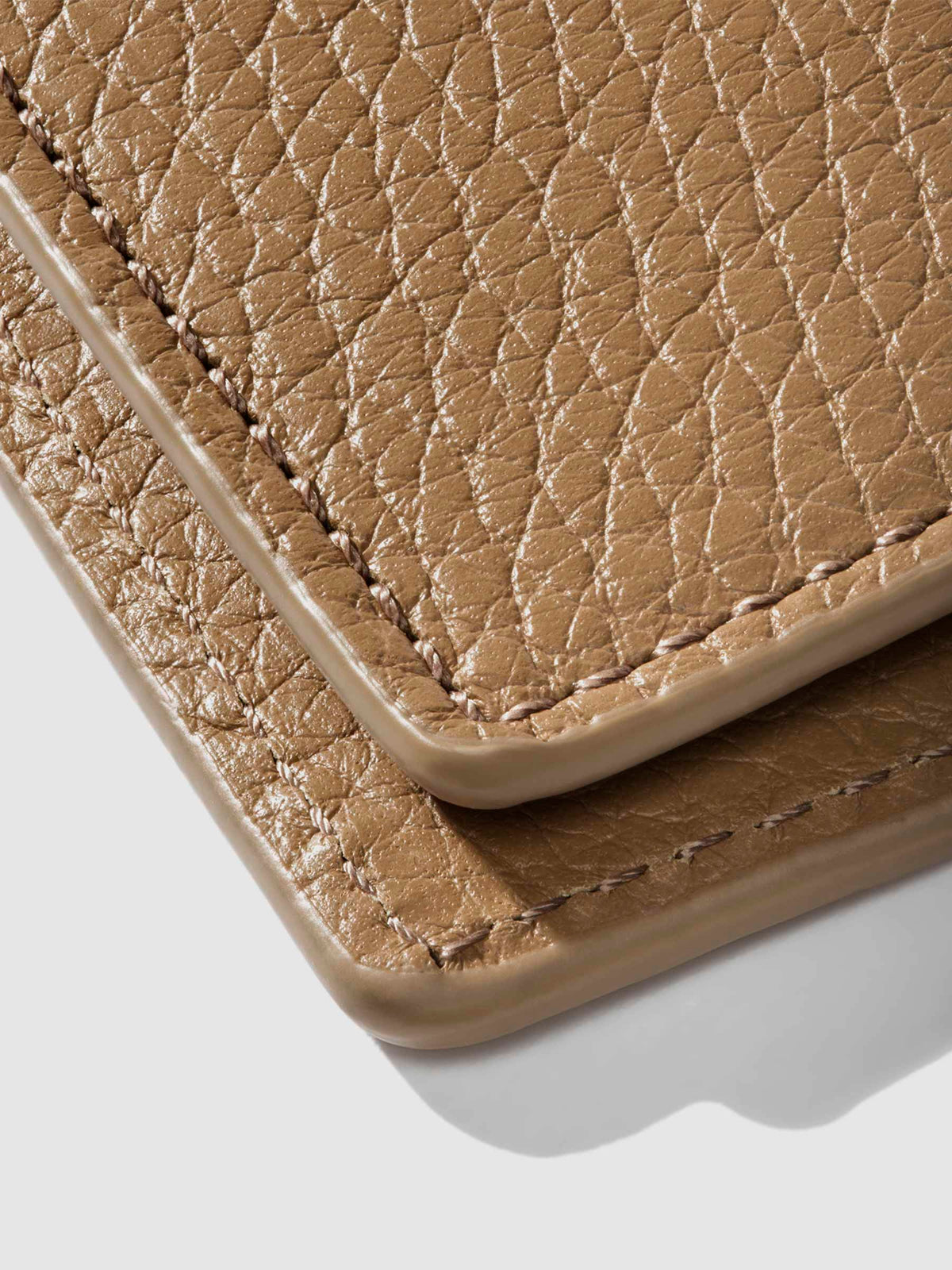 Closeup of Catalonia folio showing the stitching and glazing.