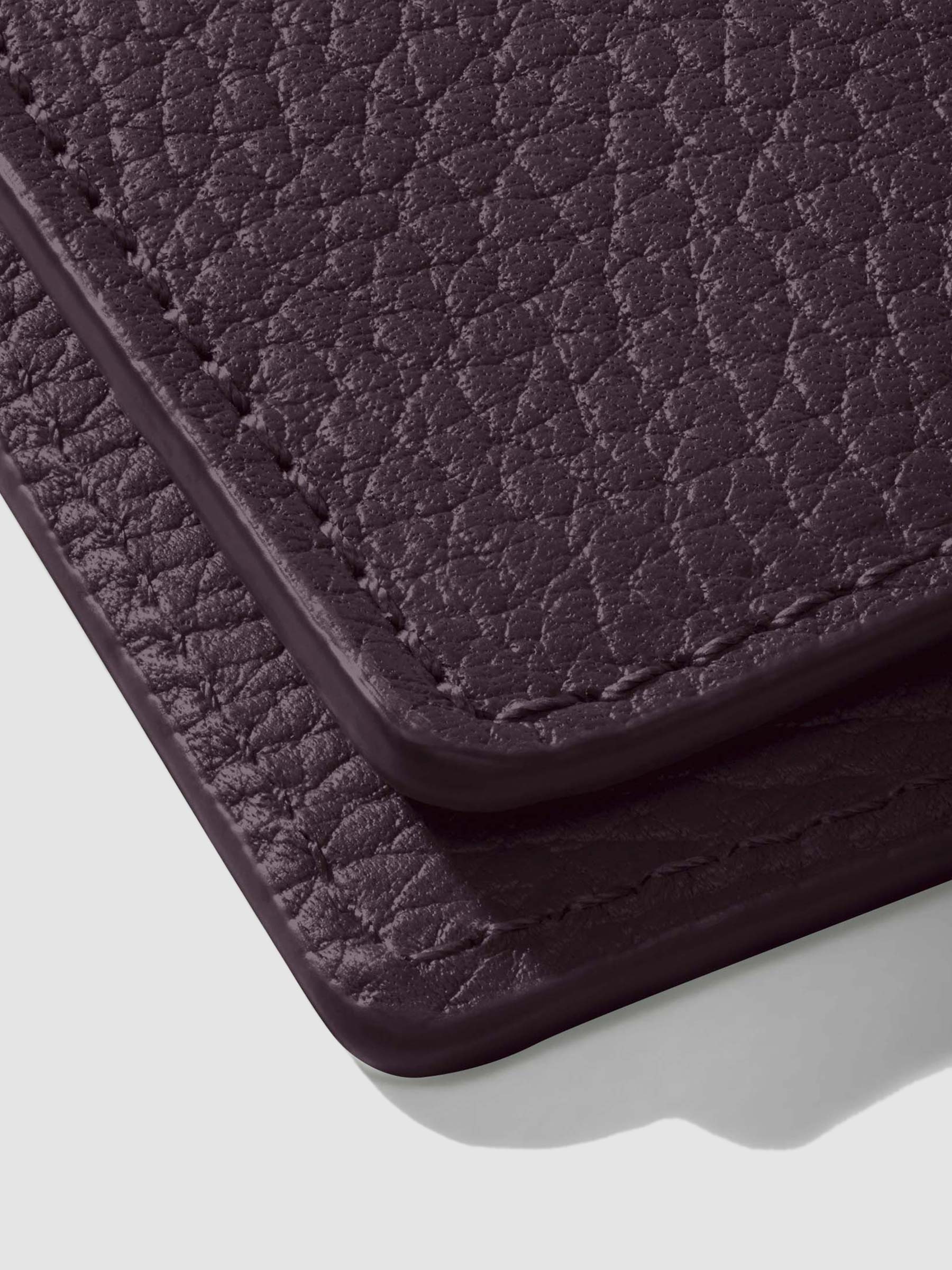 Closeup of glazing on leather folio.