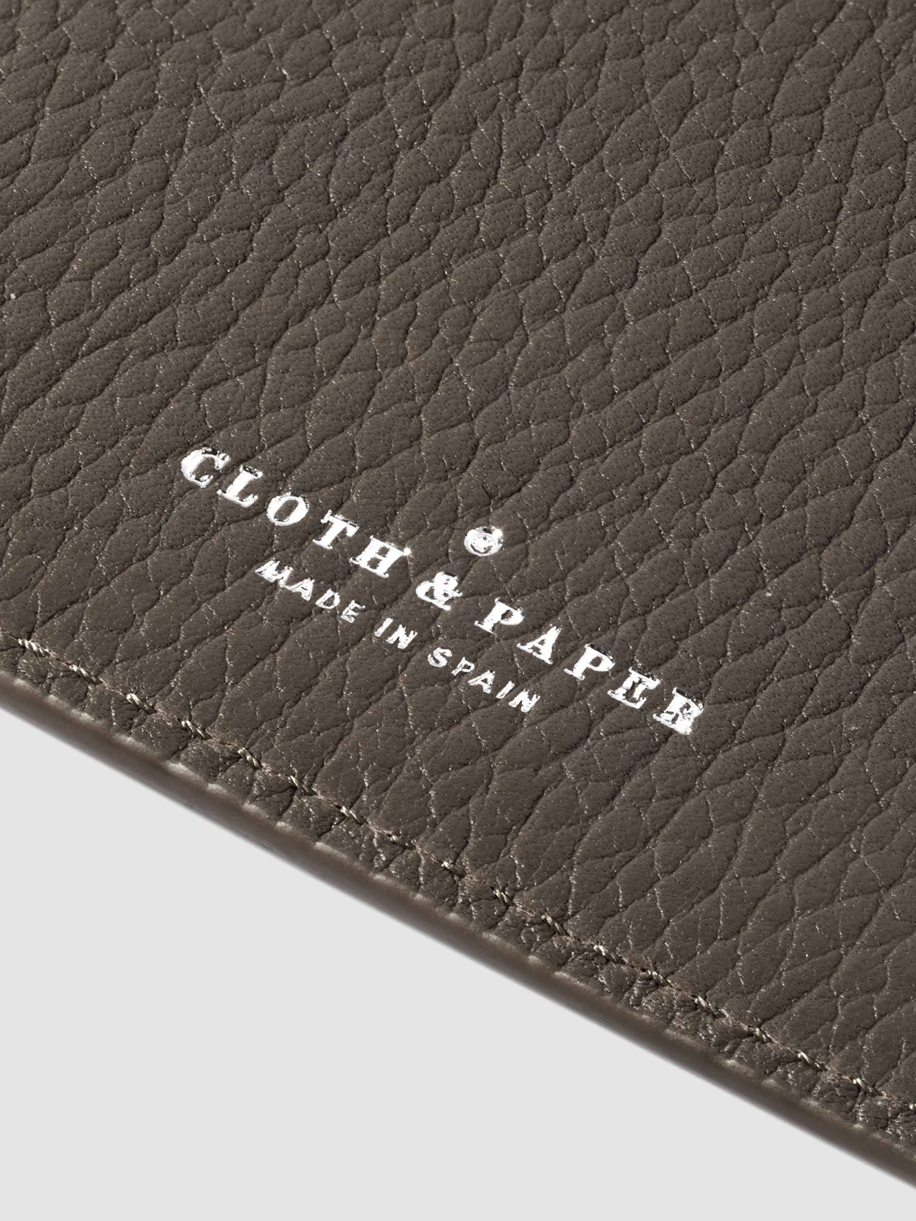 Closeup of Leon folio's foil-stamped Cloth and Paper Made in Spain logo.