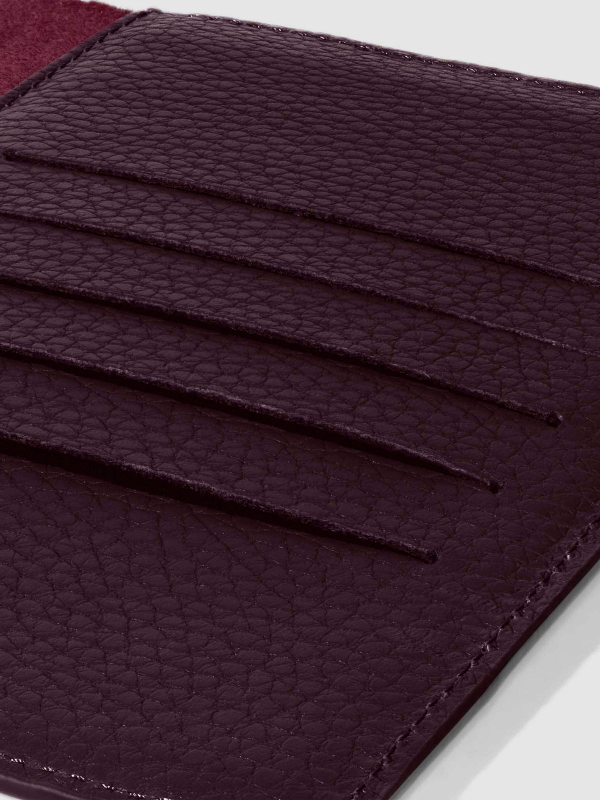 Closeup of credit card slots inside leather folio.
