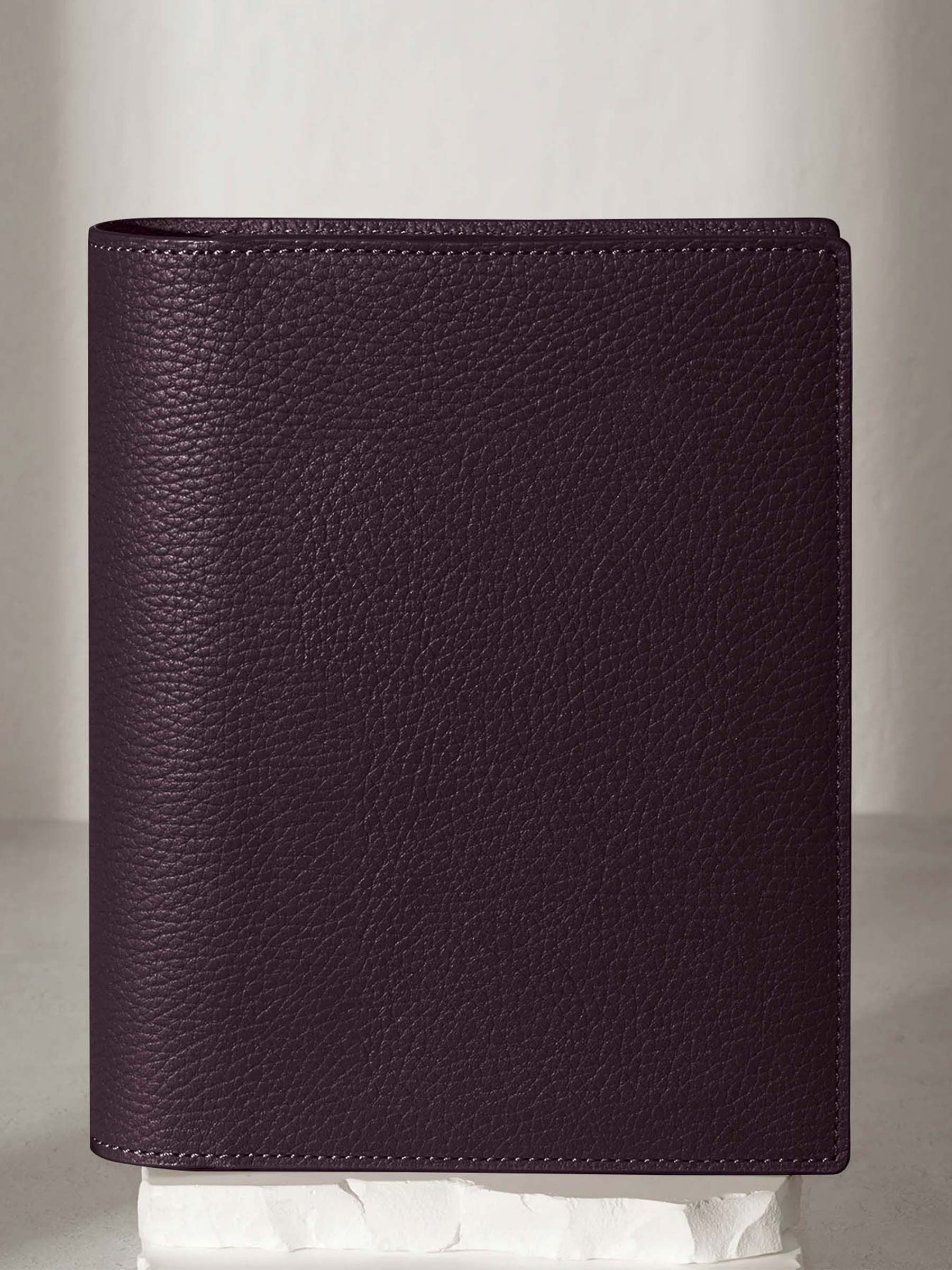 Small folio displayed on a neutral background.