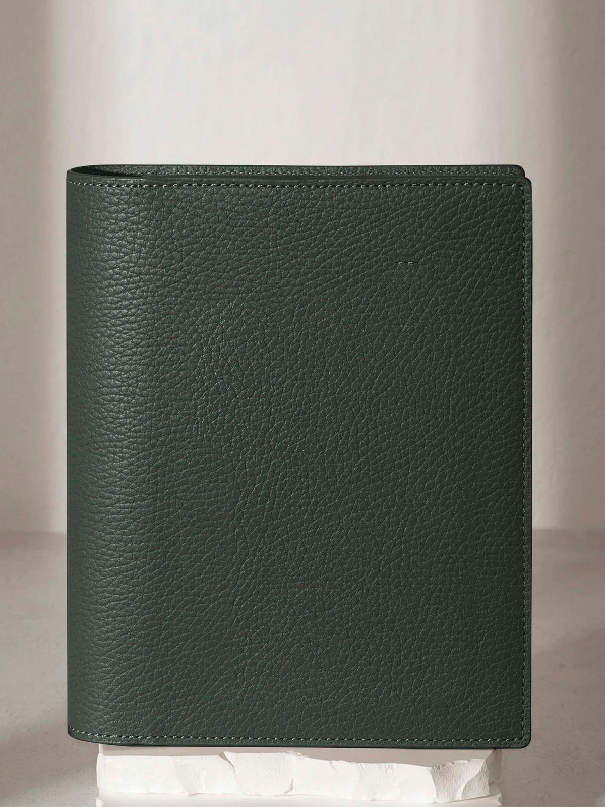 Small folio displayed on a neutral background.